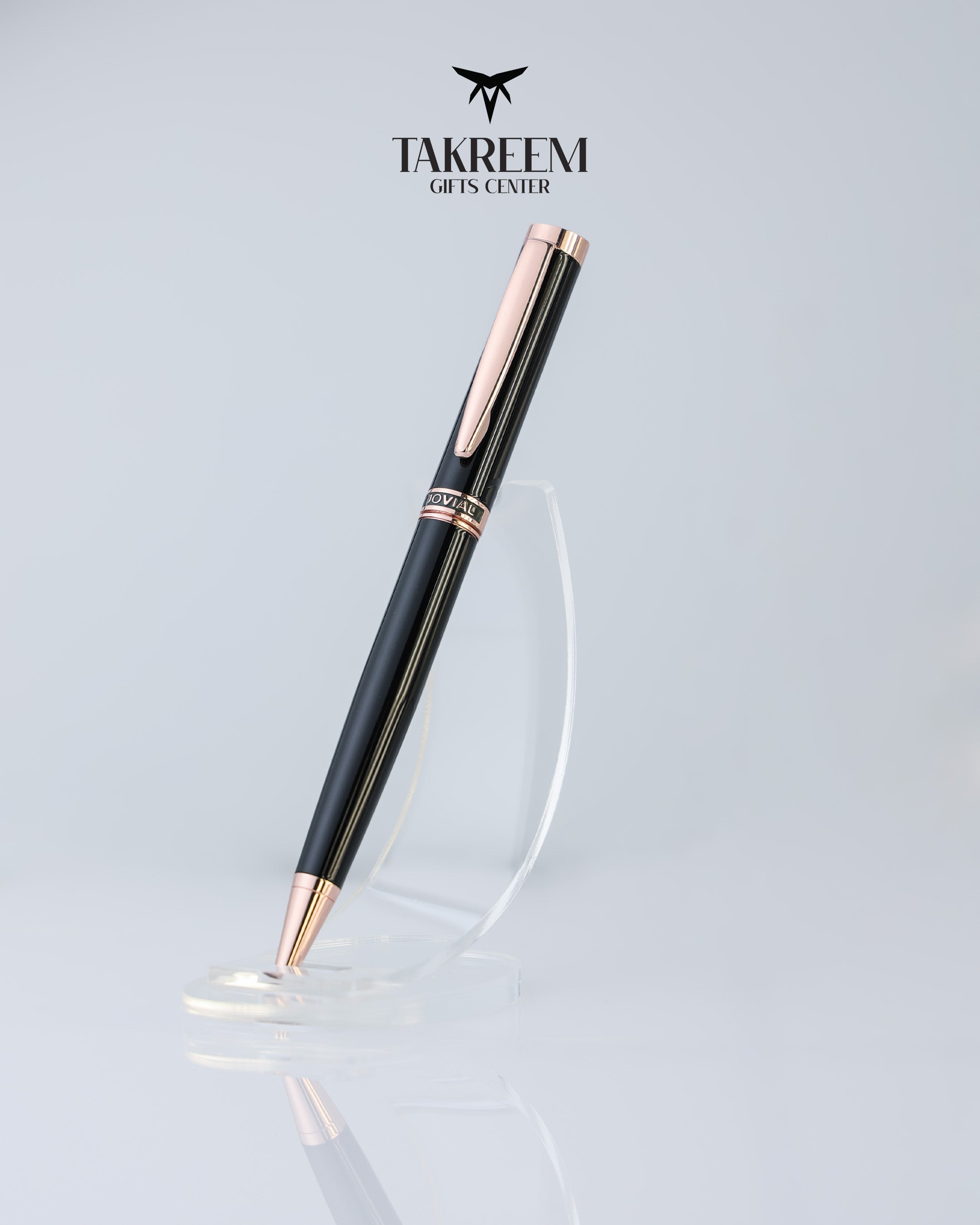 Black and rose gold pen on a light gray background with 'Takreem Gifts Center' branding.