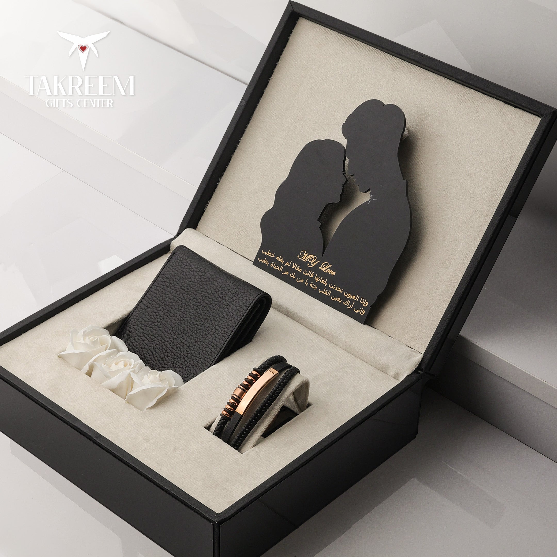 Gift set with black wallet, ring, and bracelet in a decorative box with 'JACKRETT' branding.