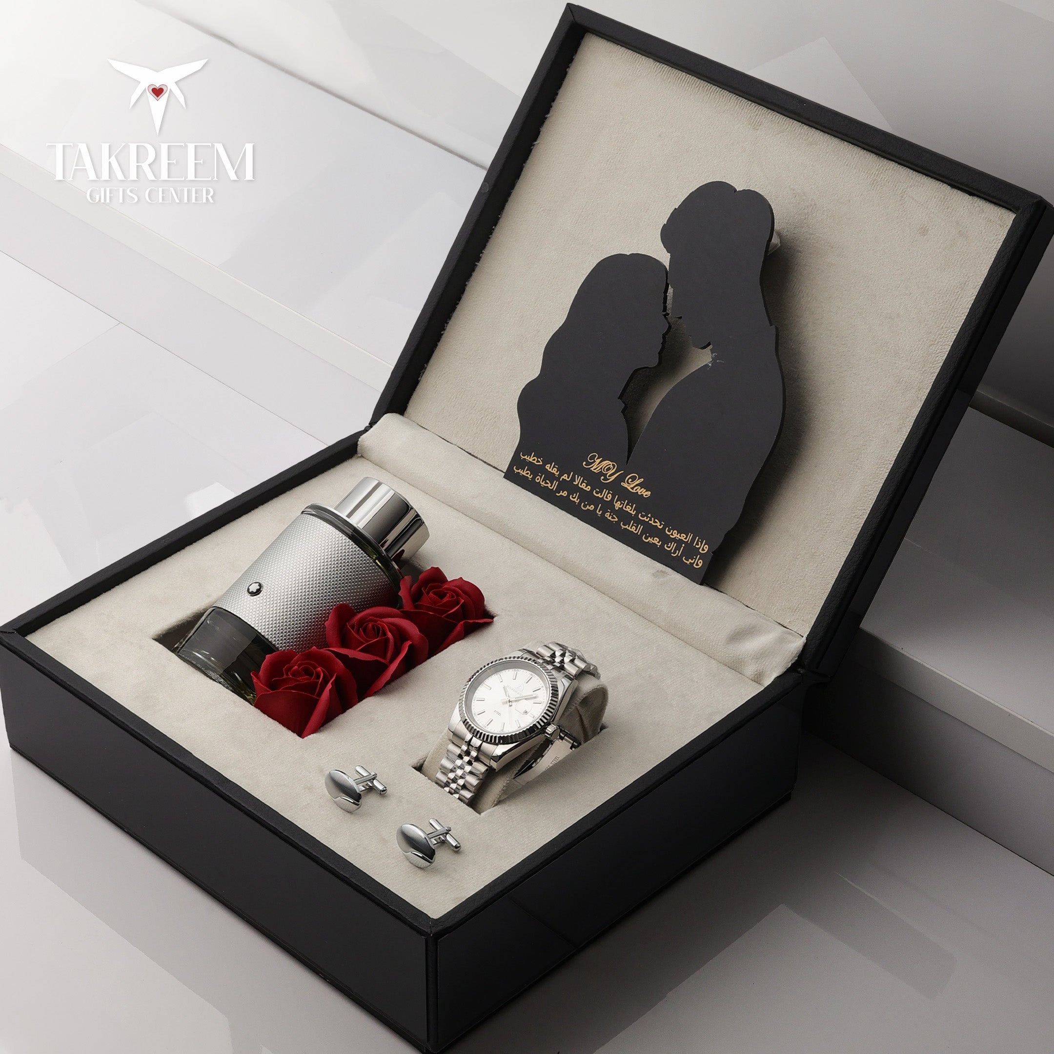 Groomsmen gift set with watch, roses, and cufflinks in a black box on a white background.