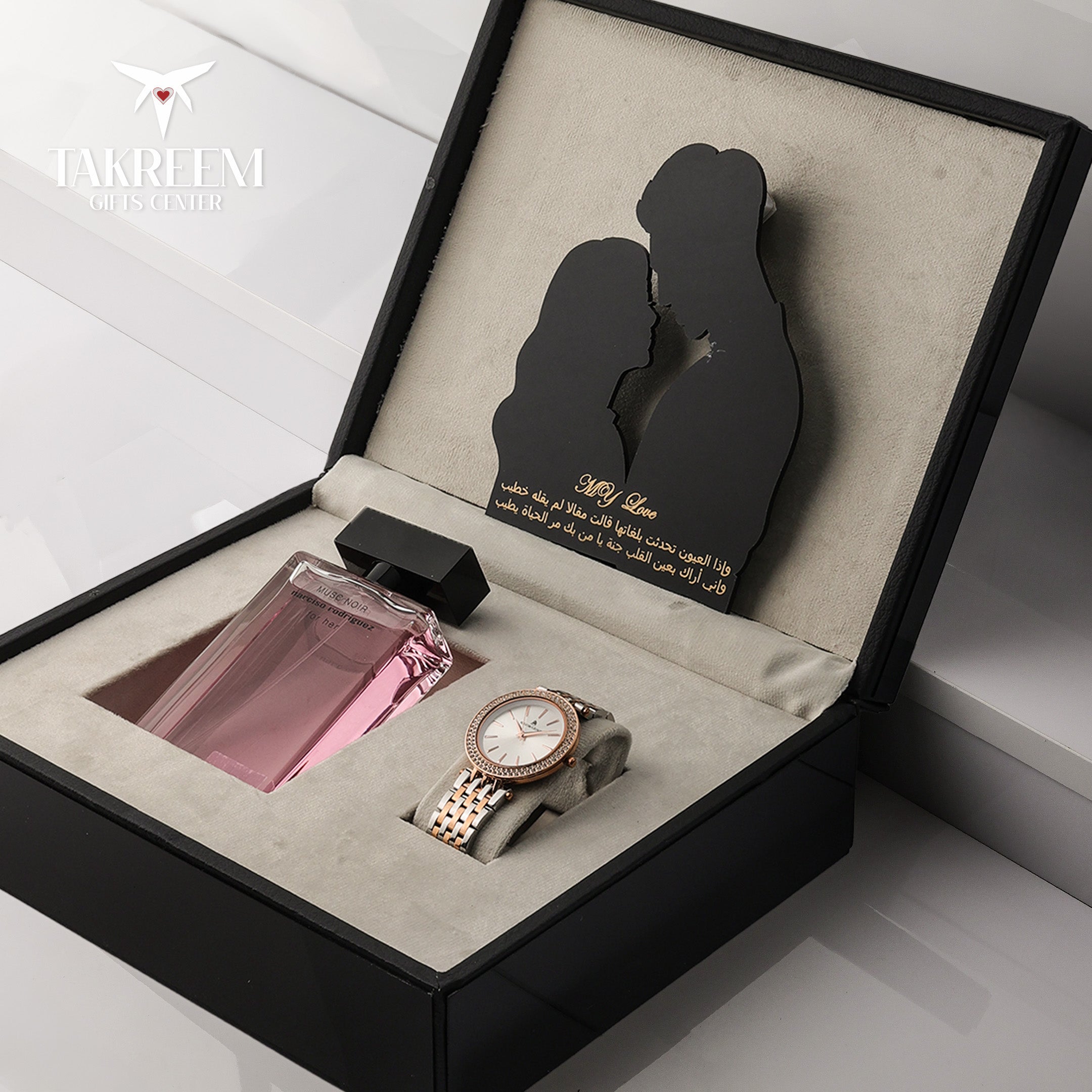Gift set with a watch and perfume in a decorative box with a couple silhouette, featuring the brand 'JACKRETT'.
