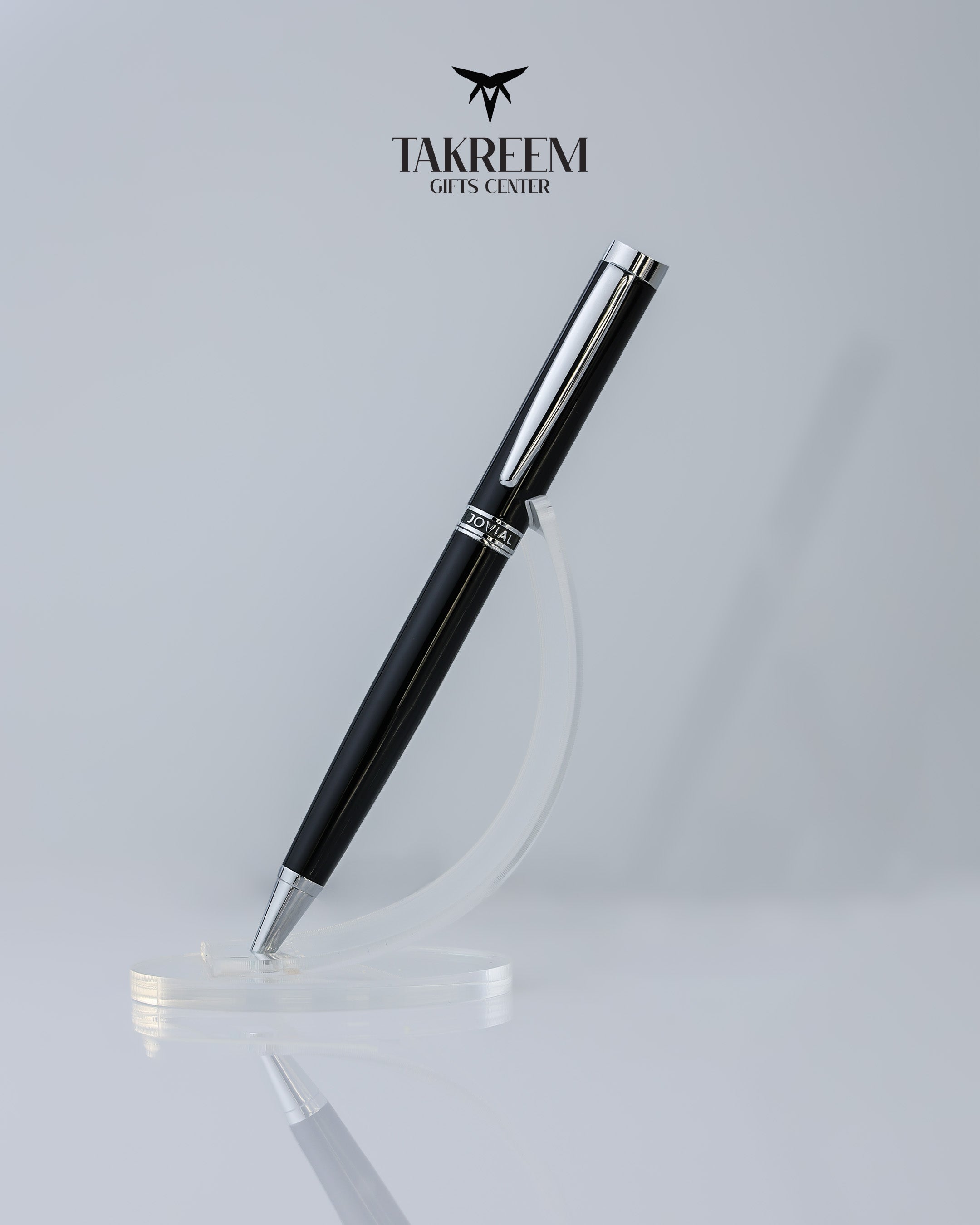 Black pen with silver accents on a light gray background, featuring the Takreem logo.