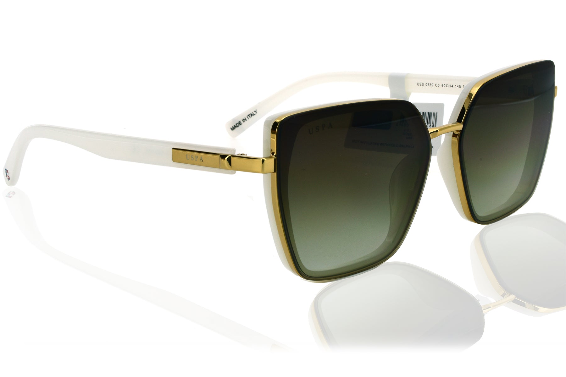 Sunglasses with gold frame and dark lenses on a white background