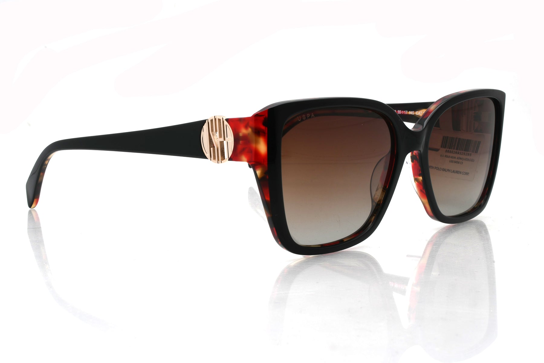 Sunglasses with tortoiseshell frame and gradient lenses on a white background