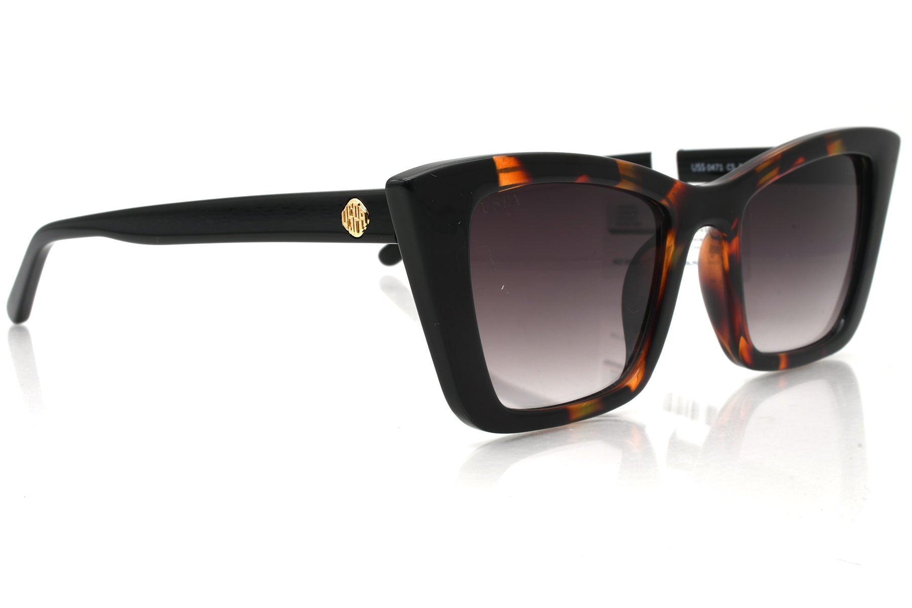 Sunglasses with tortoiseshell frame and black gradient lenses on a white background