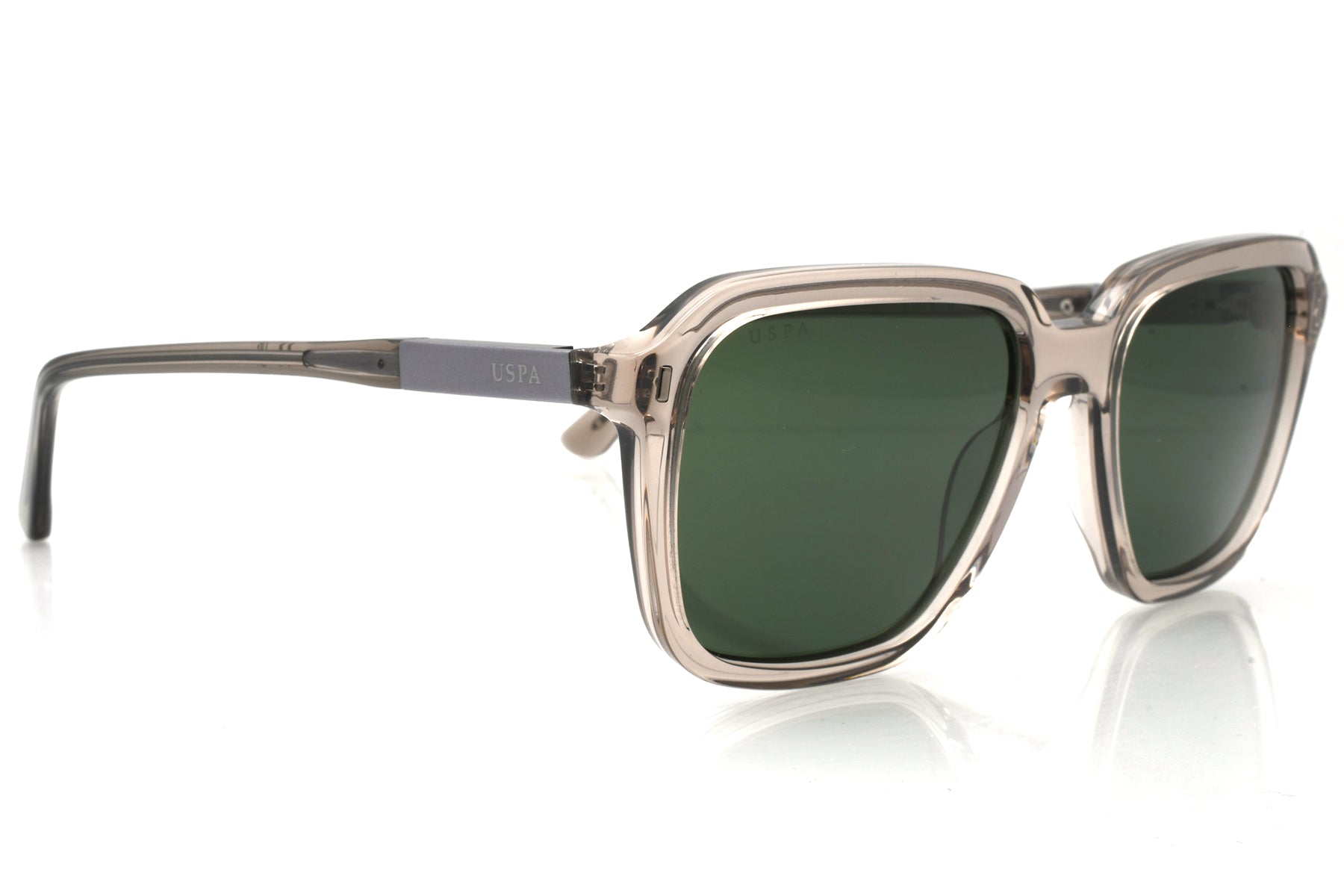 Sunglasses with a clear frame and green lenses on a white background