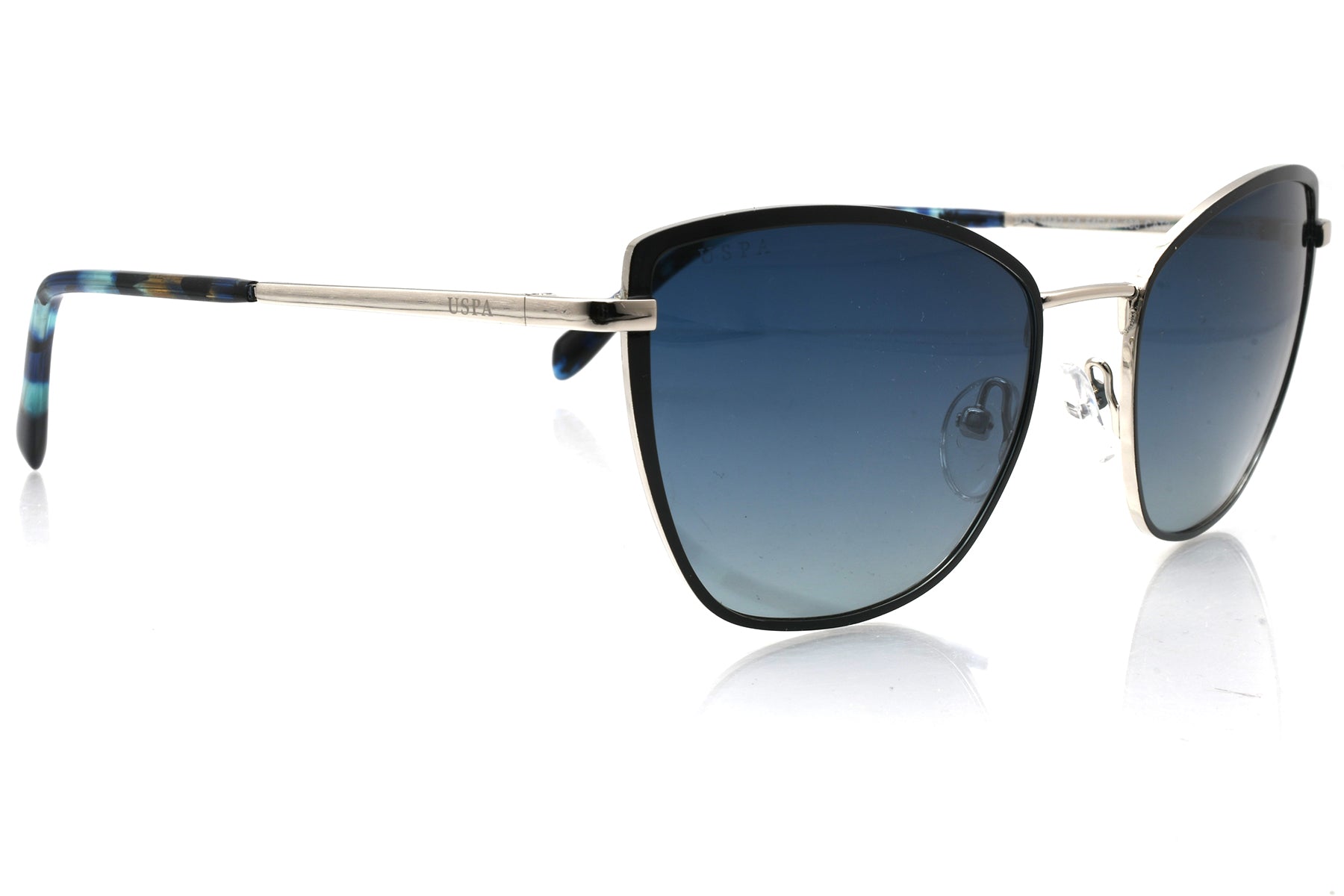 Sunglasses with blue gradient lenses and metallic frame on a white background