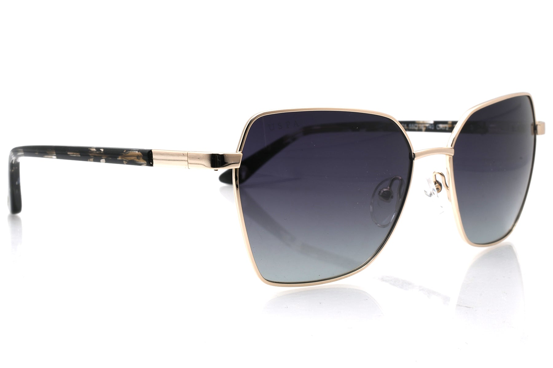 Sunglasses with gold frame and dark lenses on a white background