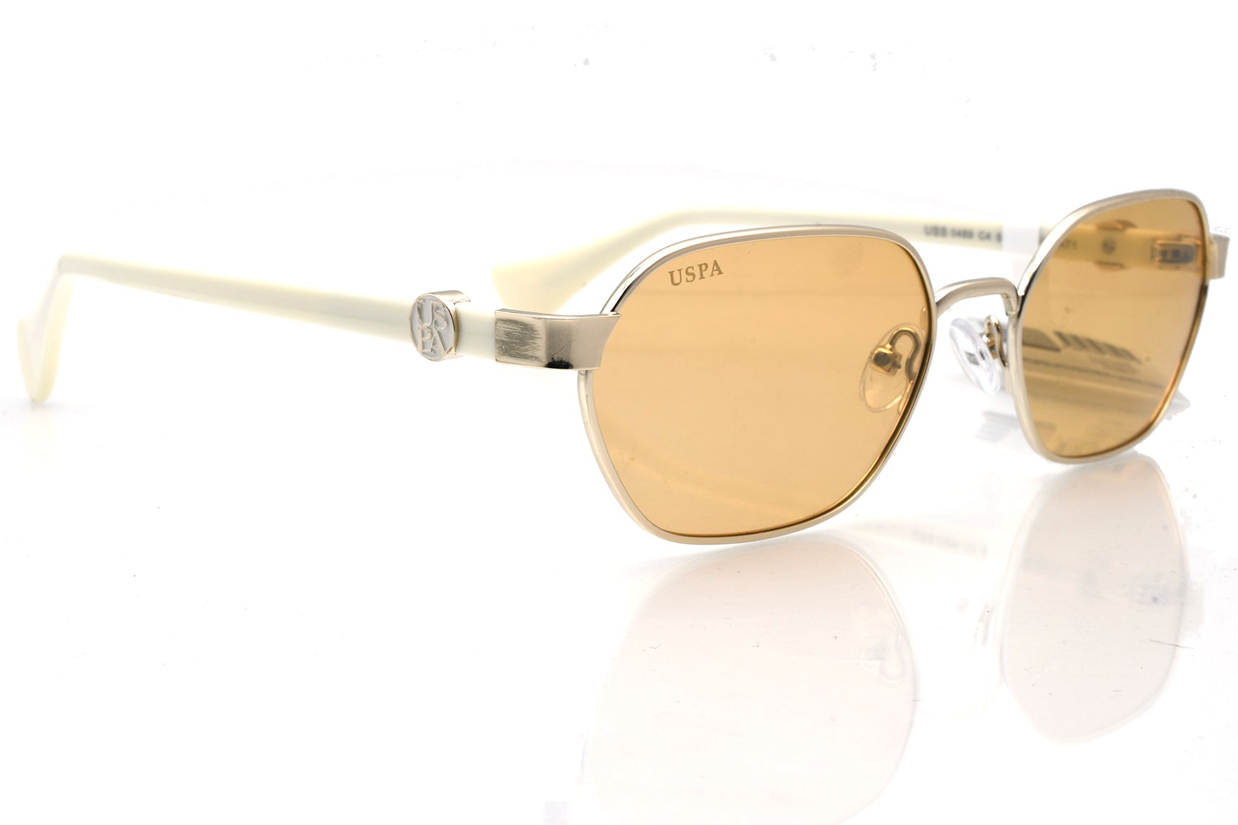 Gold sunglasses with a reflective surface on a white background