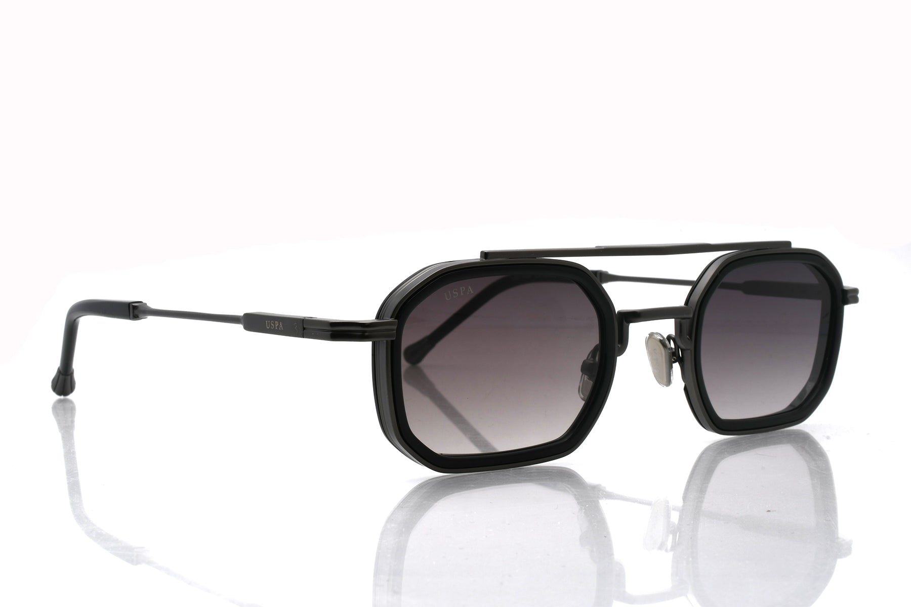 Black sunglasses with gradient lenses on a white background