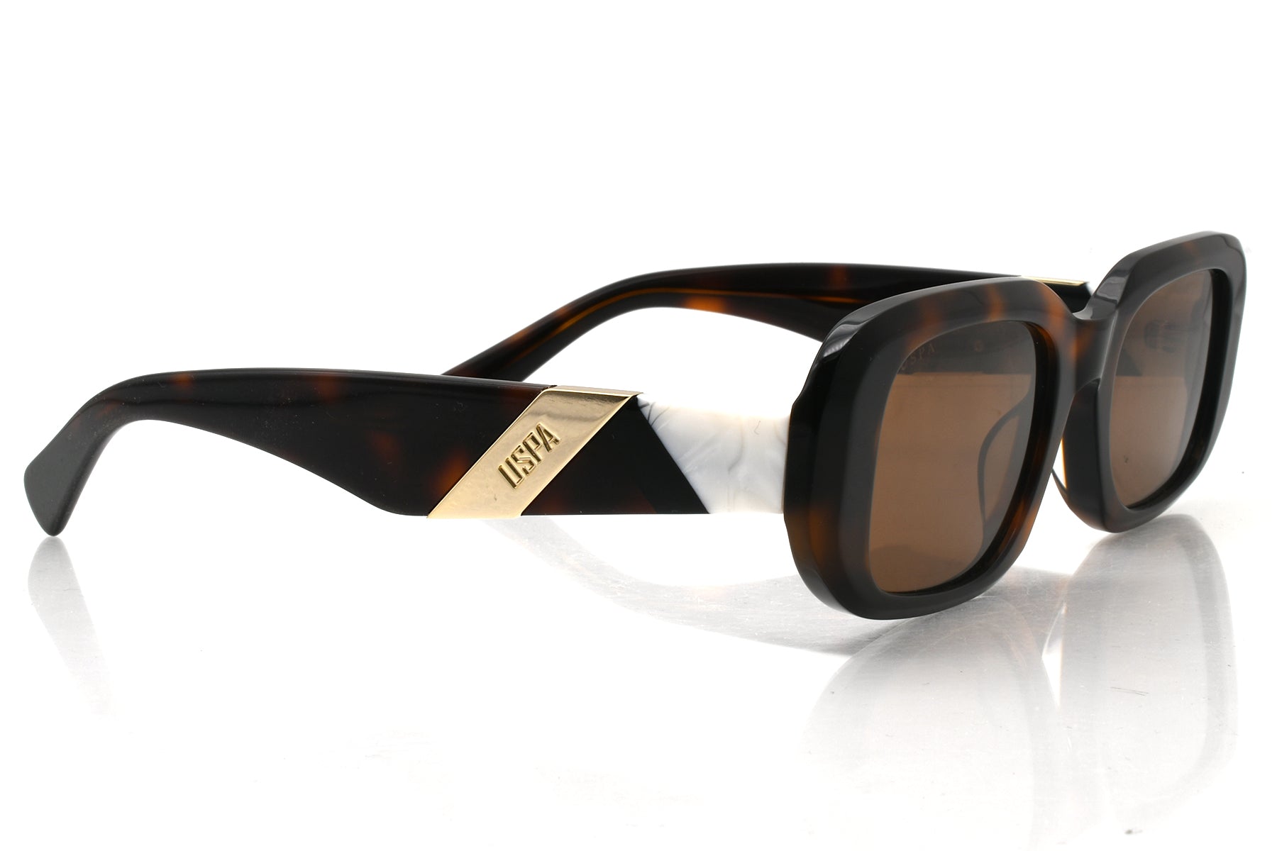 Sunglasses with tortoiseshell frame and brown lenses on a white background