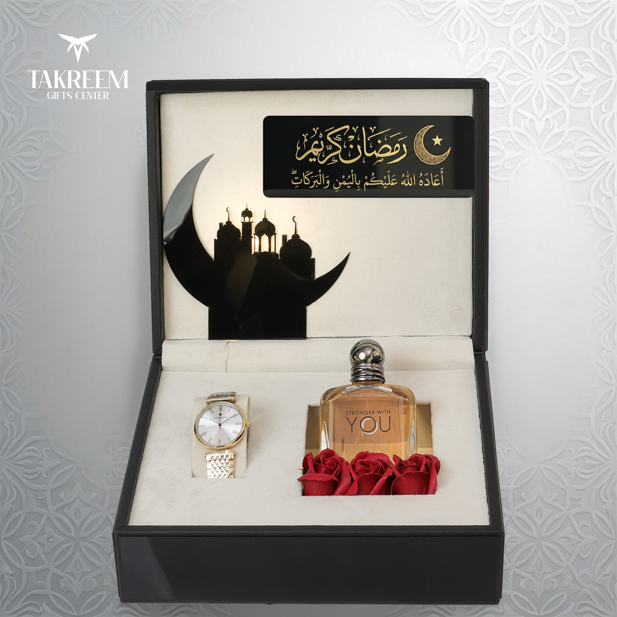 Gift set with perfume, watch, and roses in a decorative box with Arabic text and moon design.