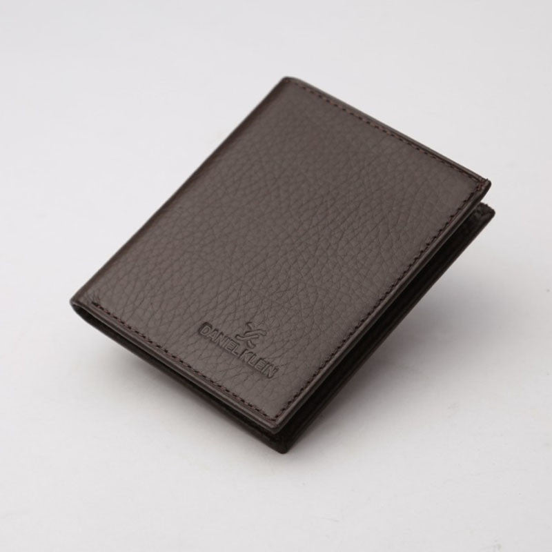 A brown genuine leather wallet with the Daniel Klein logo embossed on the front.