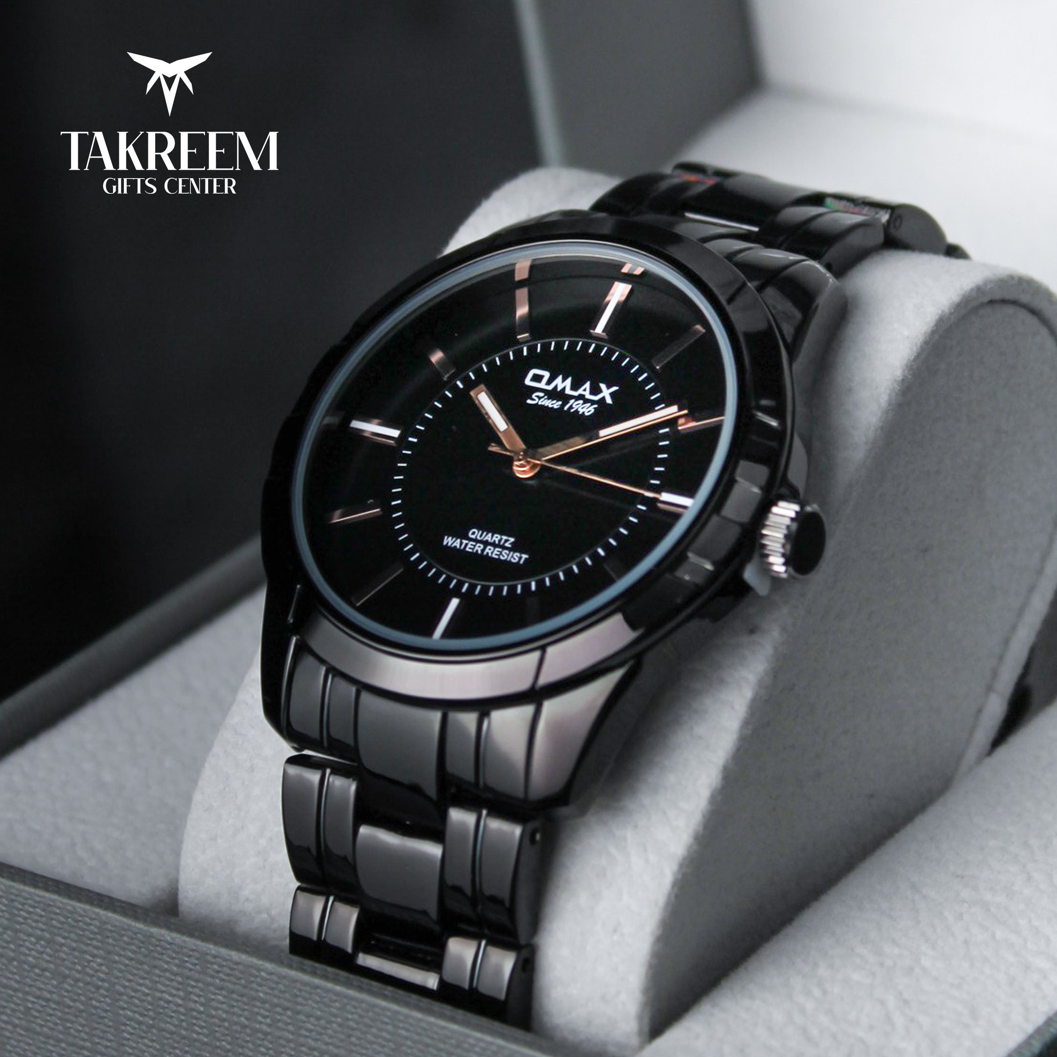 Black wristwatch with detailed design on a gray cushion, brand 'Takreem' visible.