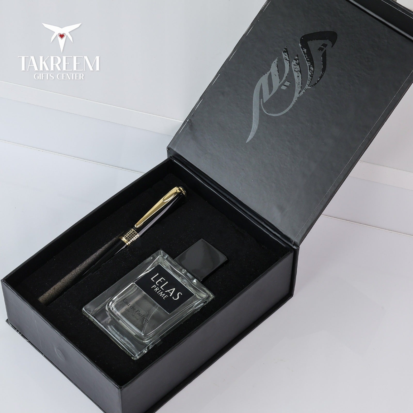 Pen and ink set in a black box with 'Takreem' branding.