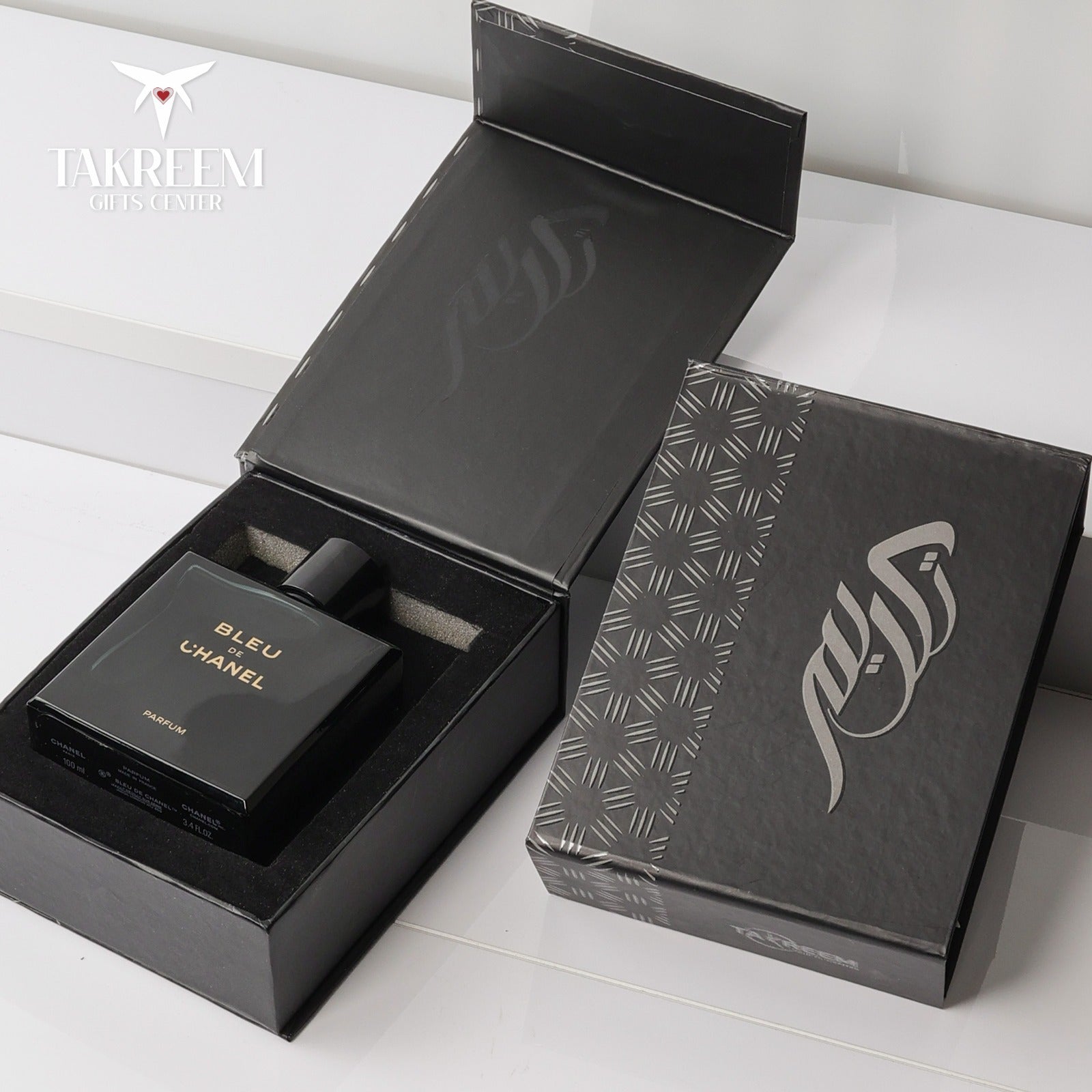 Chanel Bleu perfume bottle with packaging on a white surface