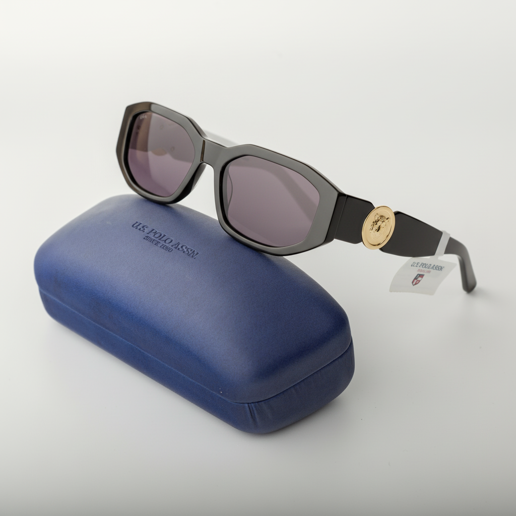 Sunglasses with a black frame and gold accent on a blue case against a white background