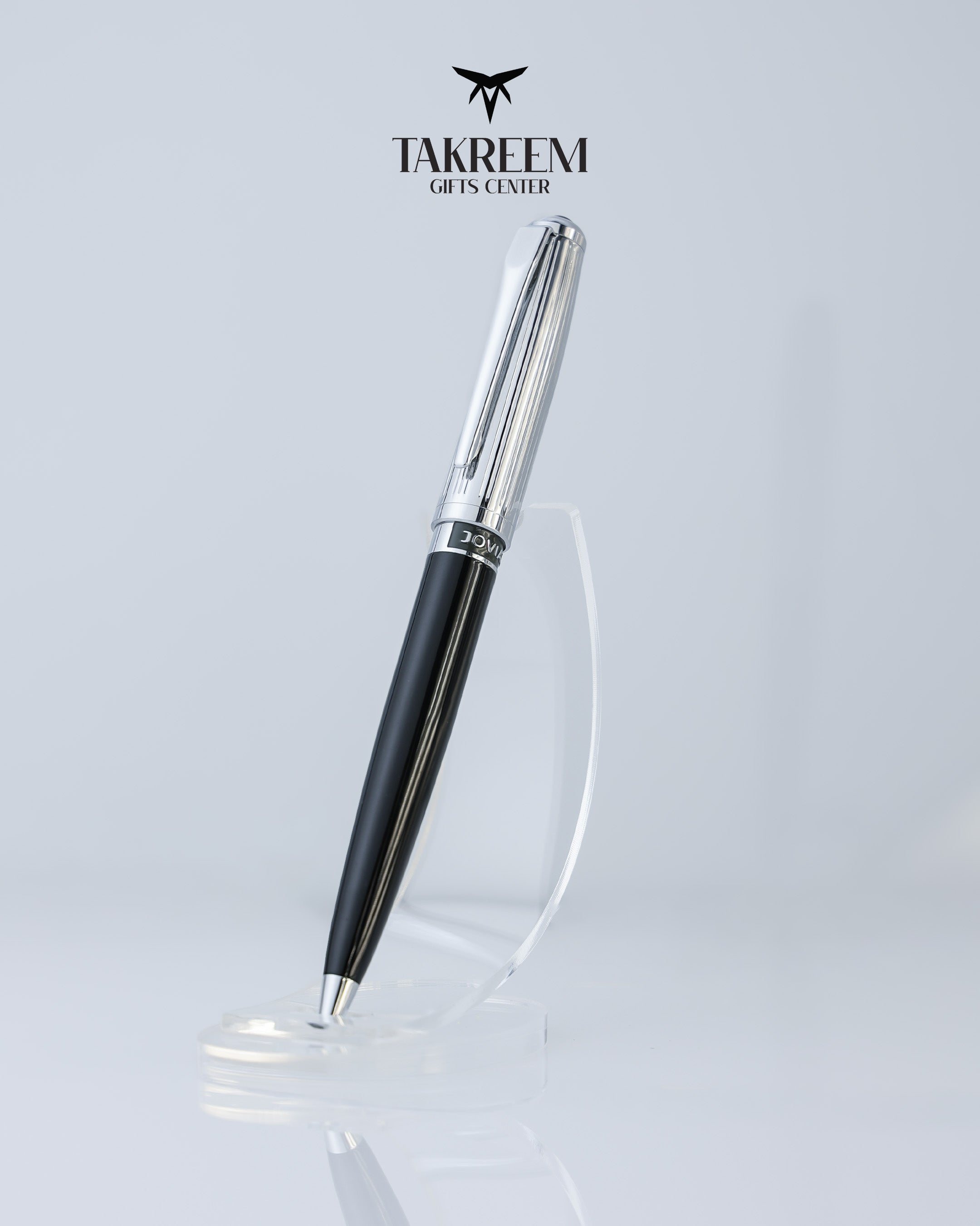Pen with black and silver design on a light gray background, featuring the Takreem Gifts Center logo.