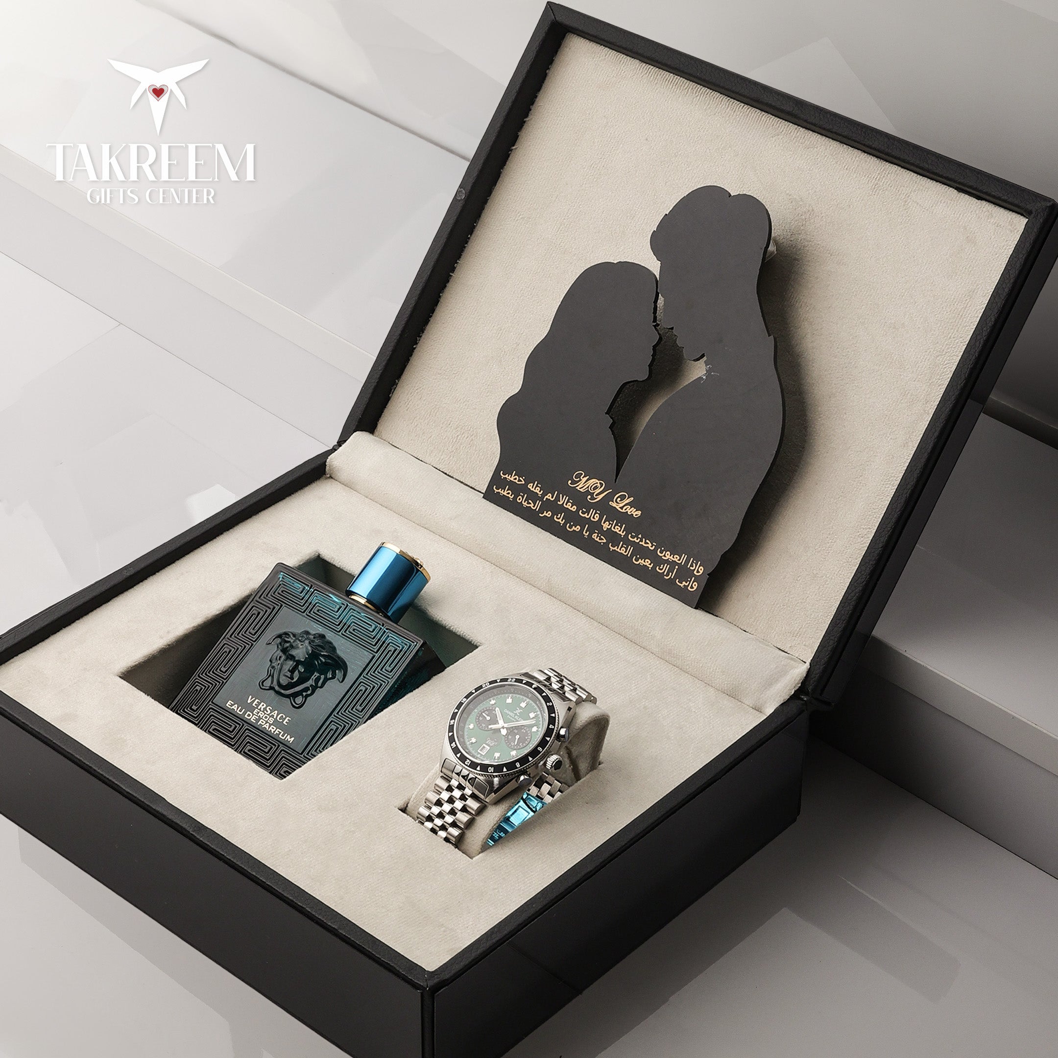Gift set with a watch and perfume bottle in an open box with a couple silhouette, featuring the brand 'JAKREI'.