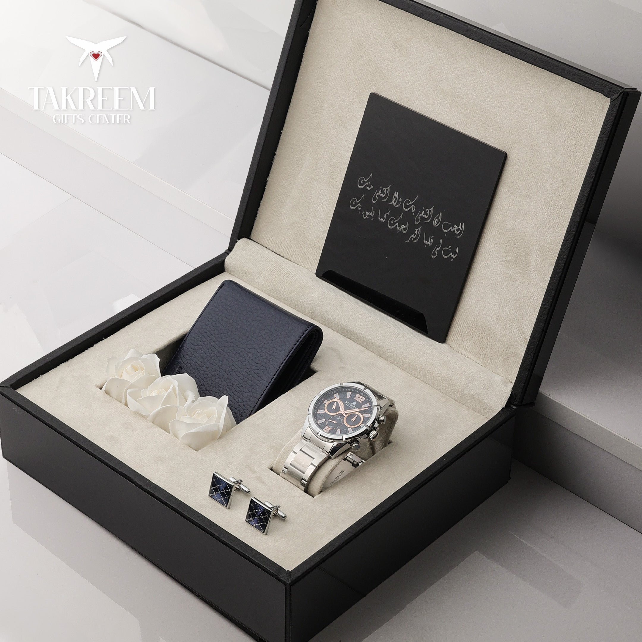 Luxury watch, tie, and cufflinks set in a branded box