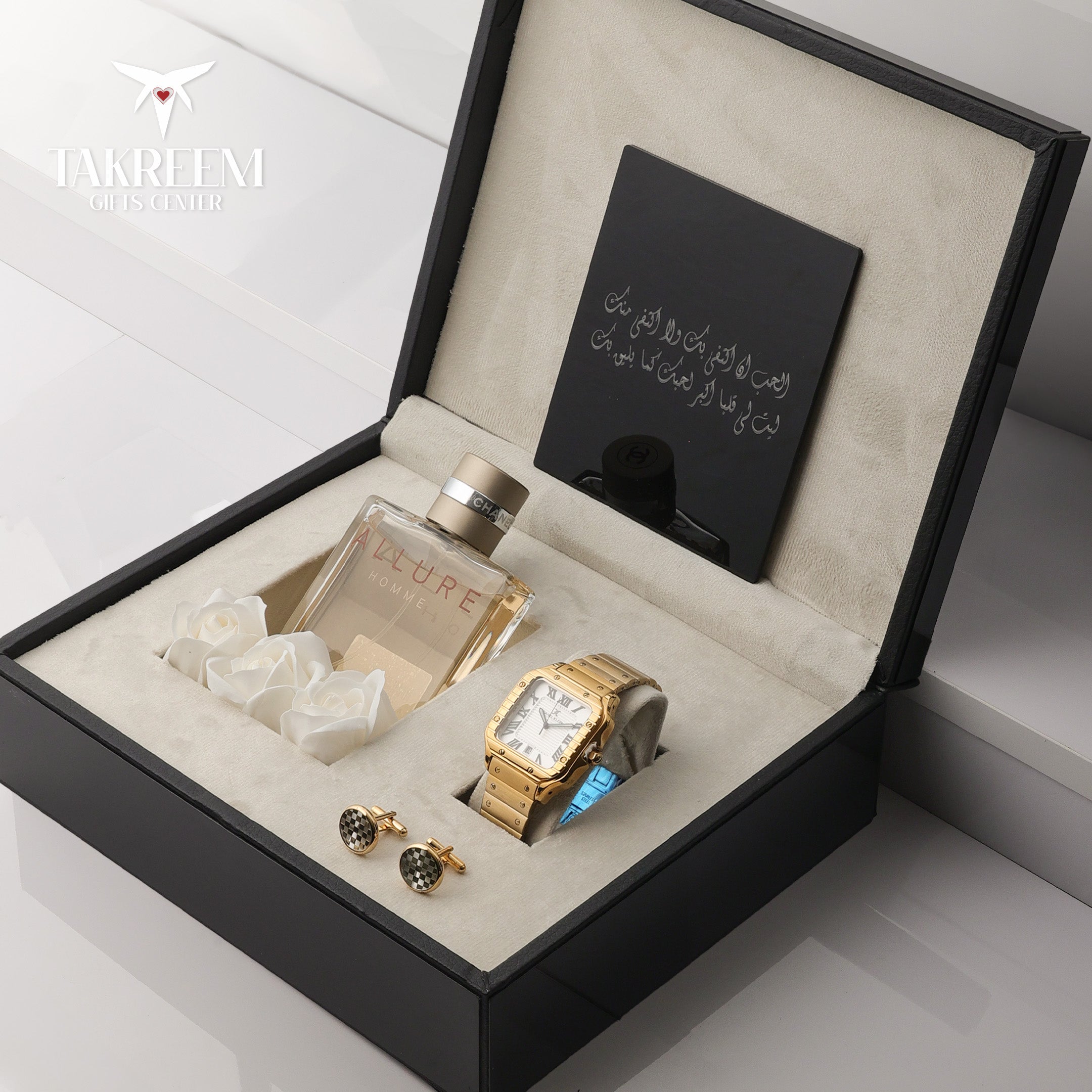 Luxury gift set with a watch, perfume, and cufflinks in an open box.