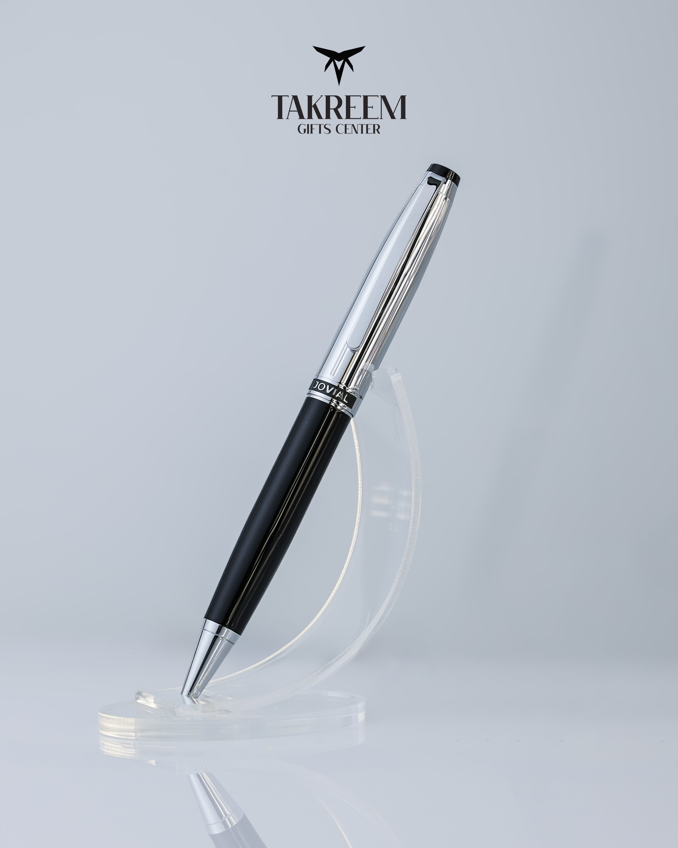 Pen with black and silver design on a light gray background, featuring the Takreem logo.