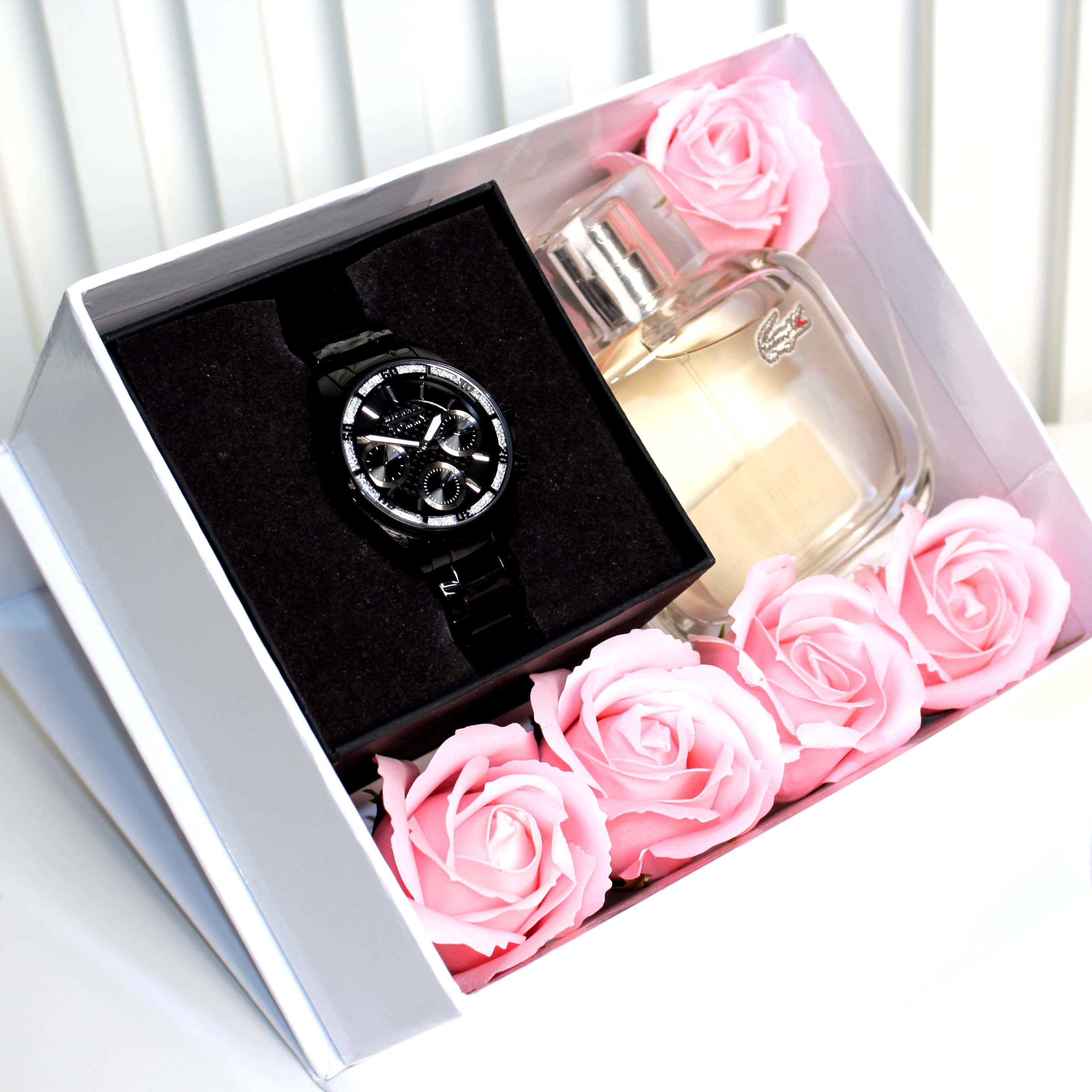 Watch and perfume bottle with pink roses in a box