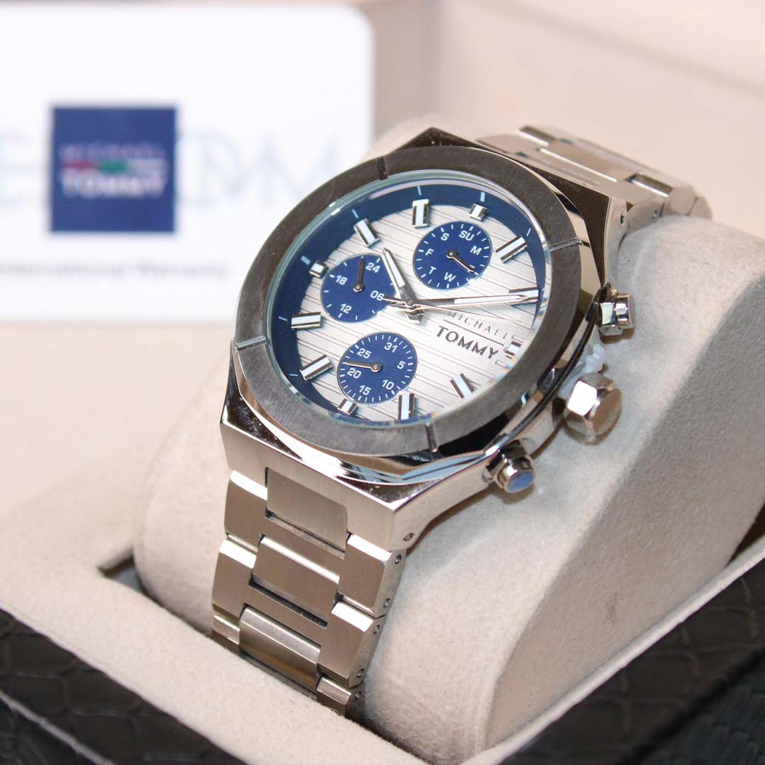 Tommy Hilfiger watch with blue face and silver band on a display box