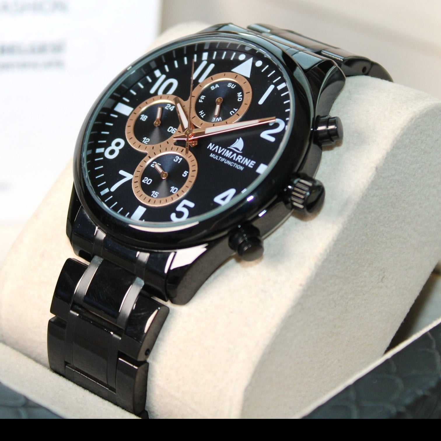 Black Navimagine watch on a white surface