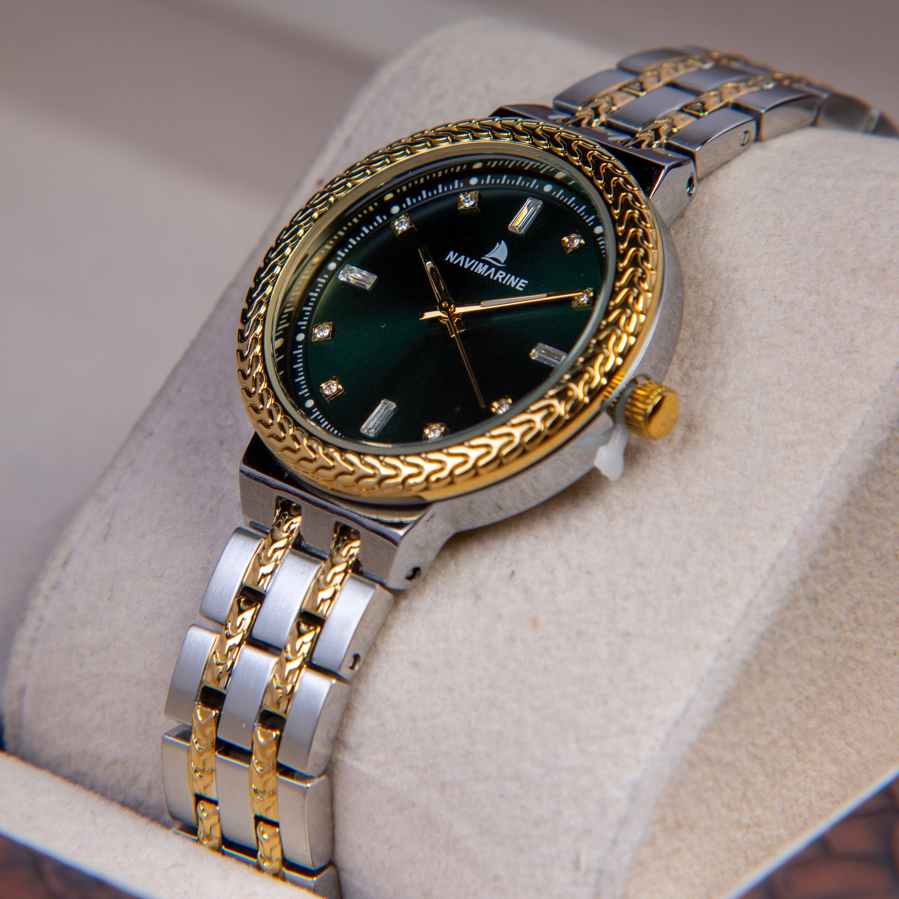 Luxury watch with gold and silver band on a soft surface