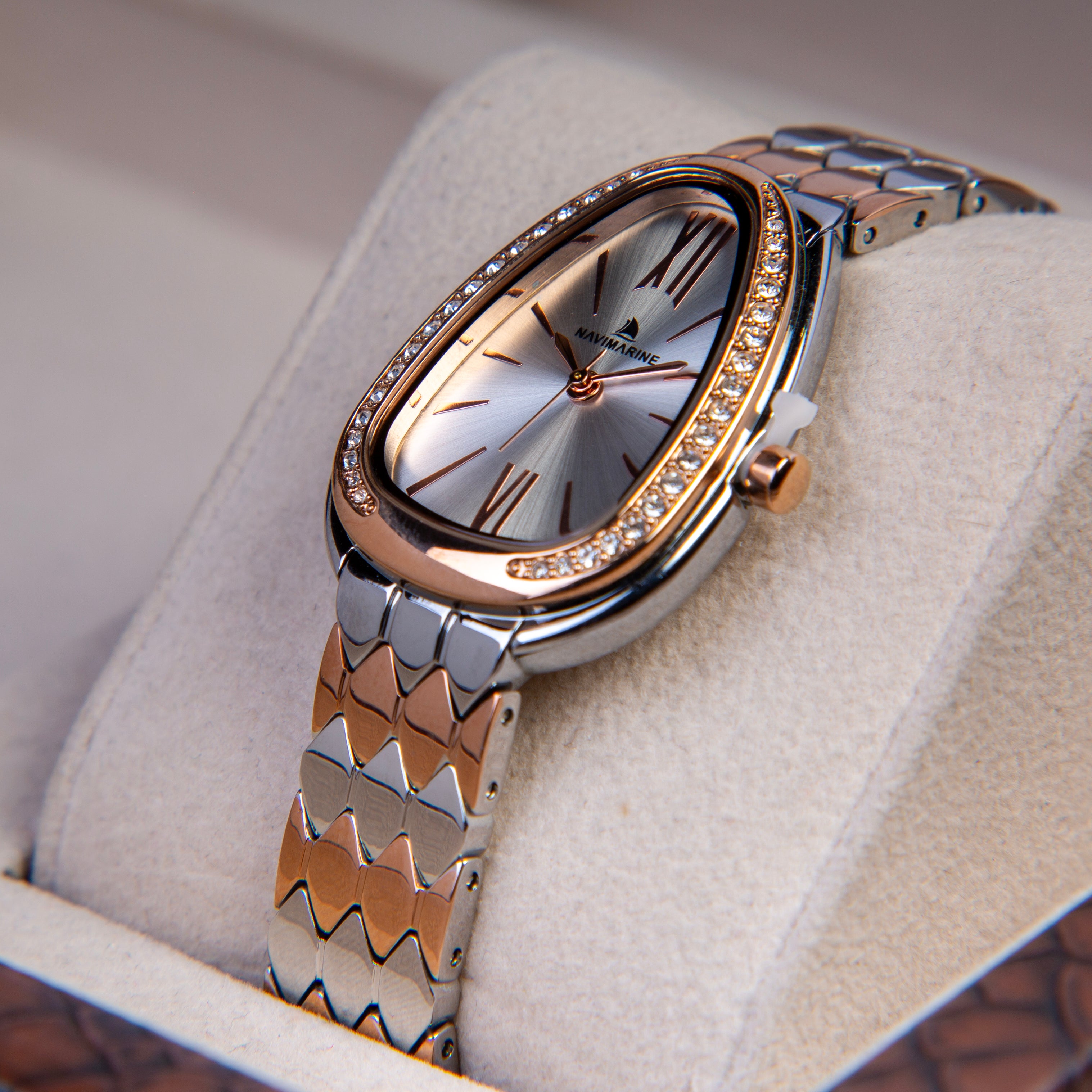 Luxury watch with a decorative band on a soft surface