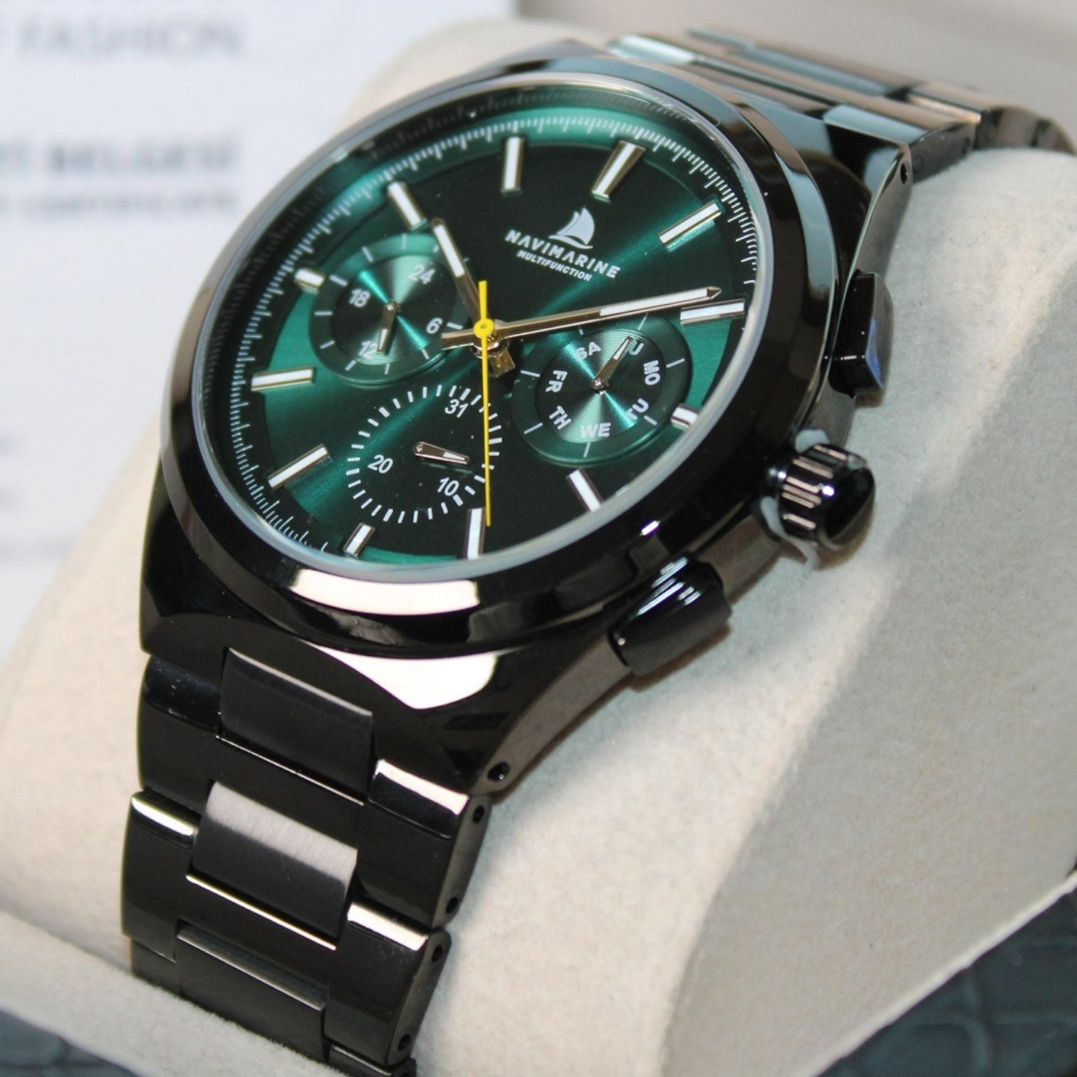 Marvinine watch with green face and black strap on a light background