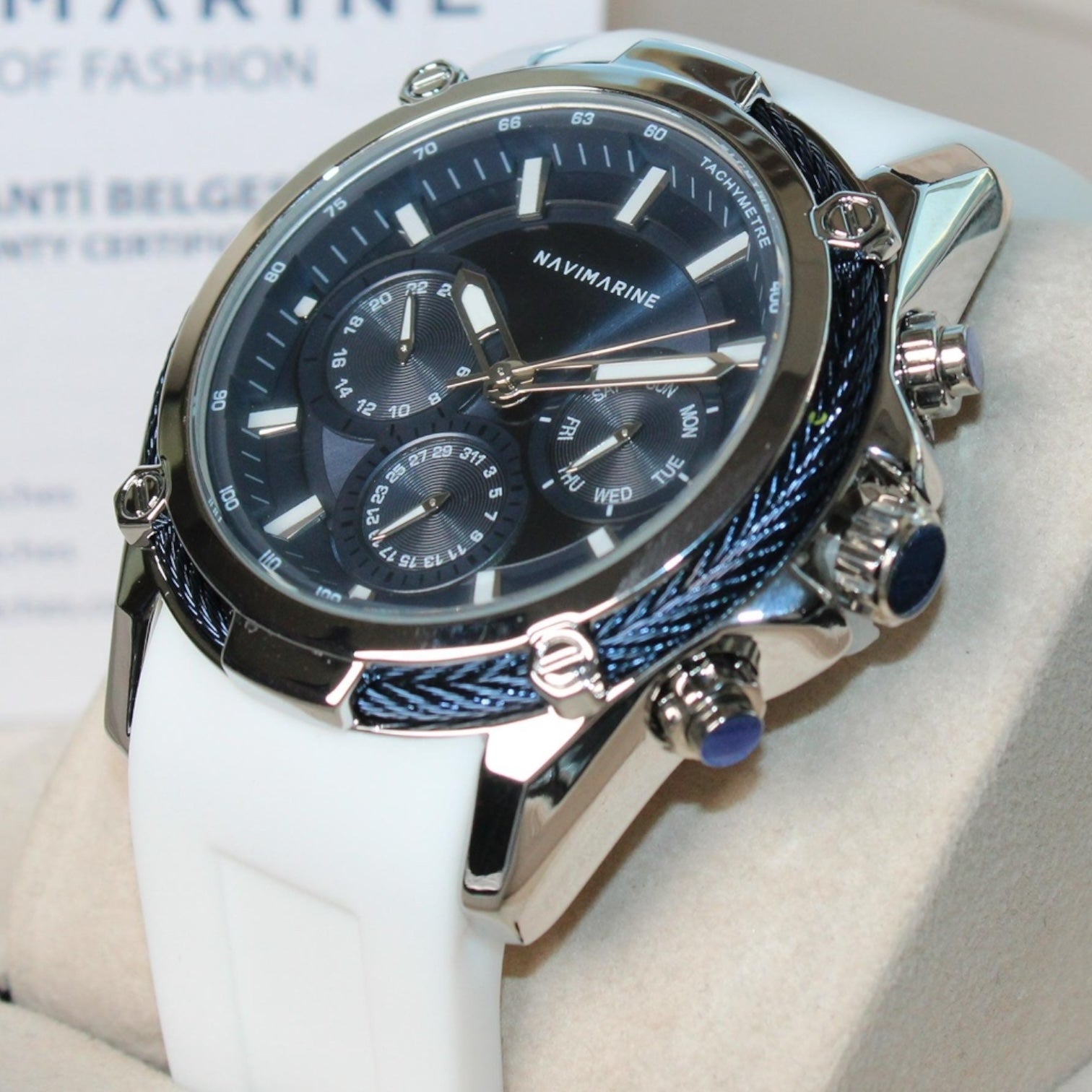 Navimarine watch with blue face and silver case on a white background