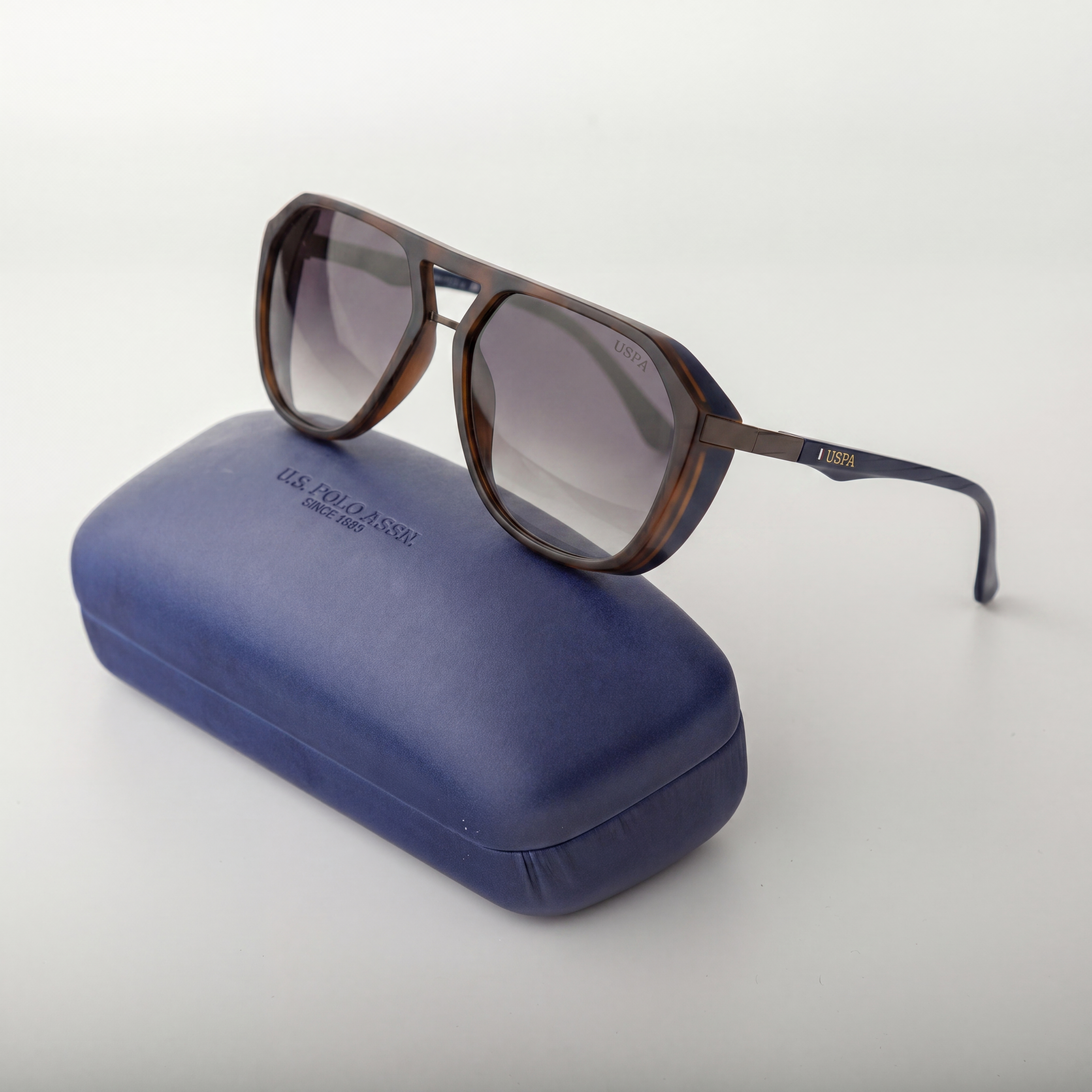 Sunglasses with a blue case on a white background