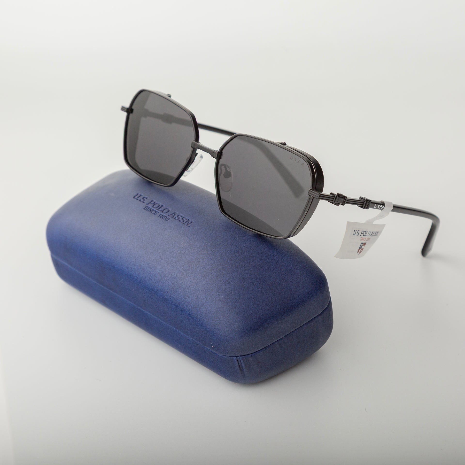 Sunglasses with a blue case on a white background
