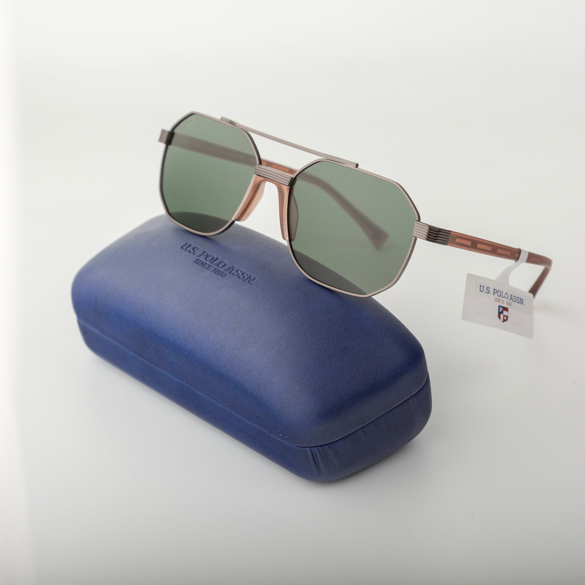Sunglasses with a blue case on a white background