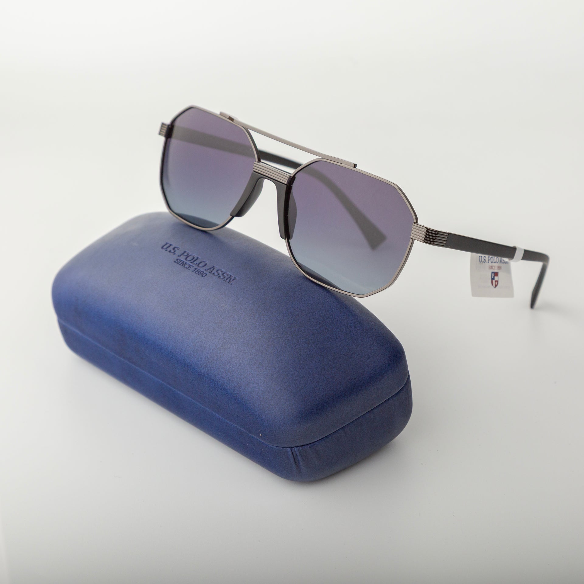 Sunglasses with a blue case on a white background
