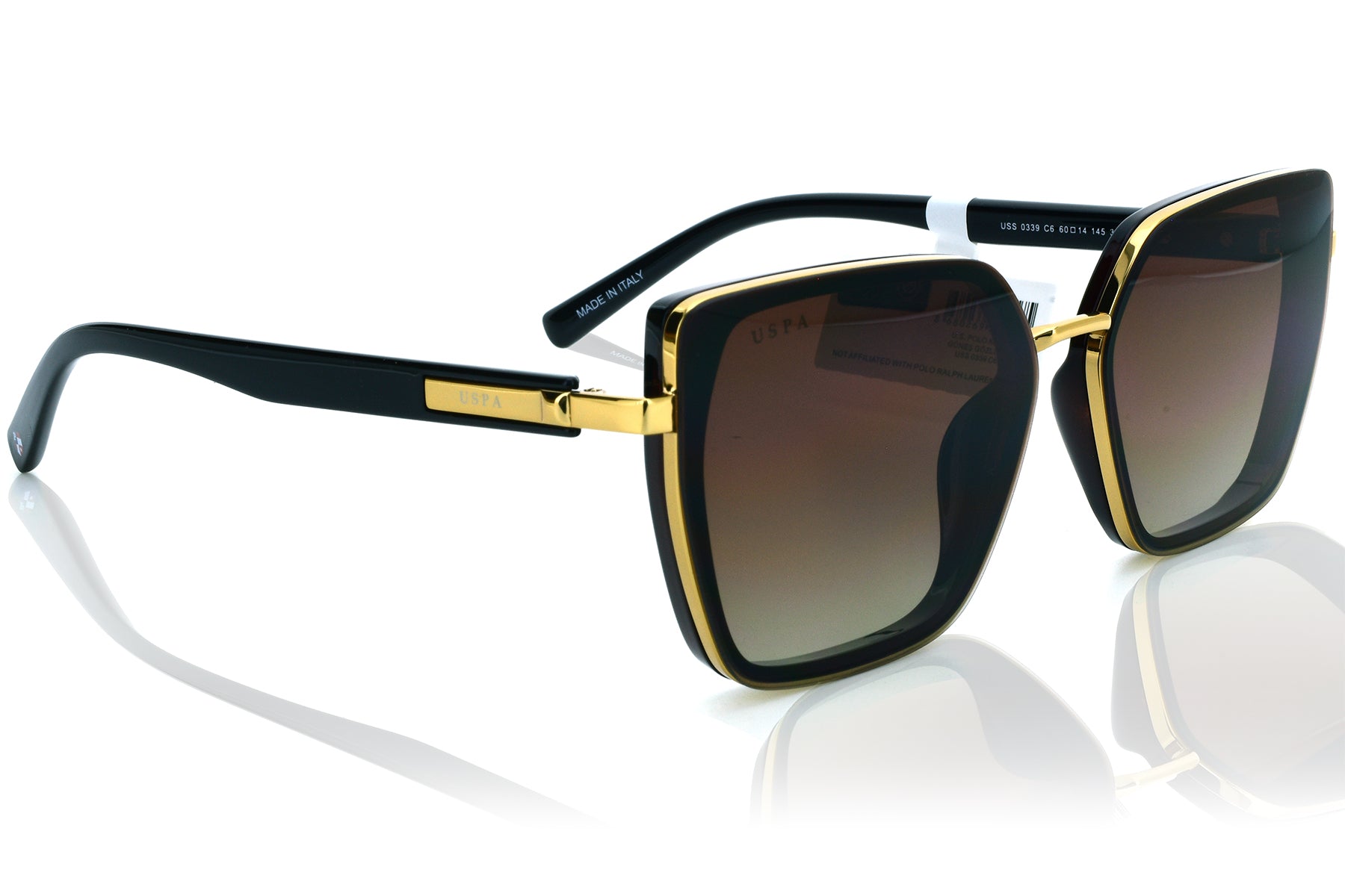 Sunglasses with black and gold frame on a white background
