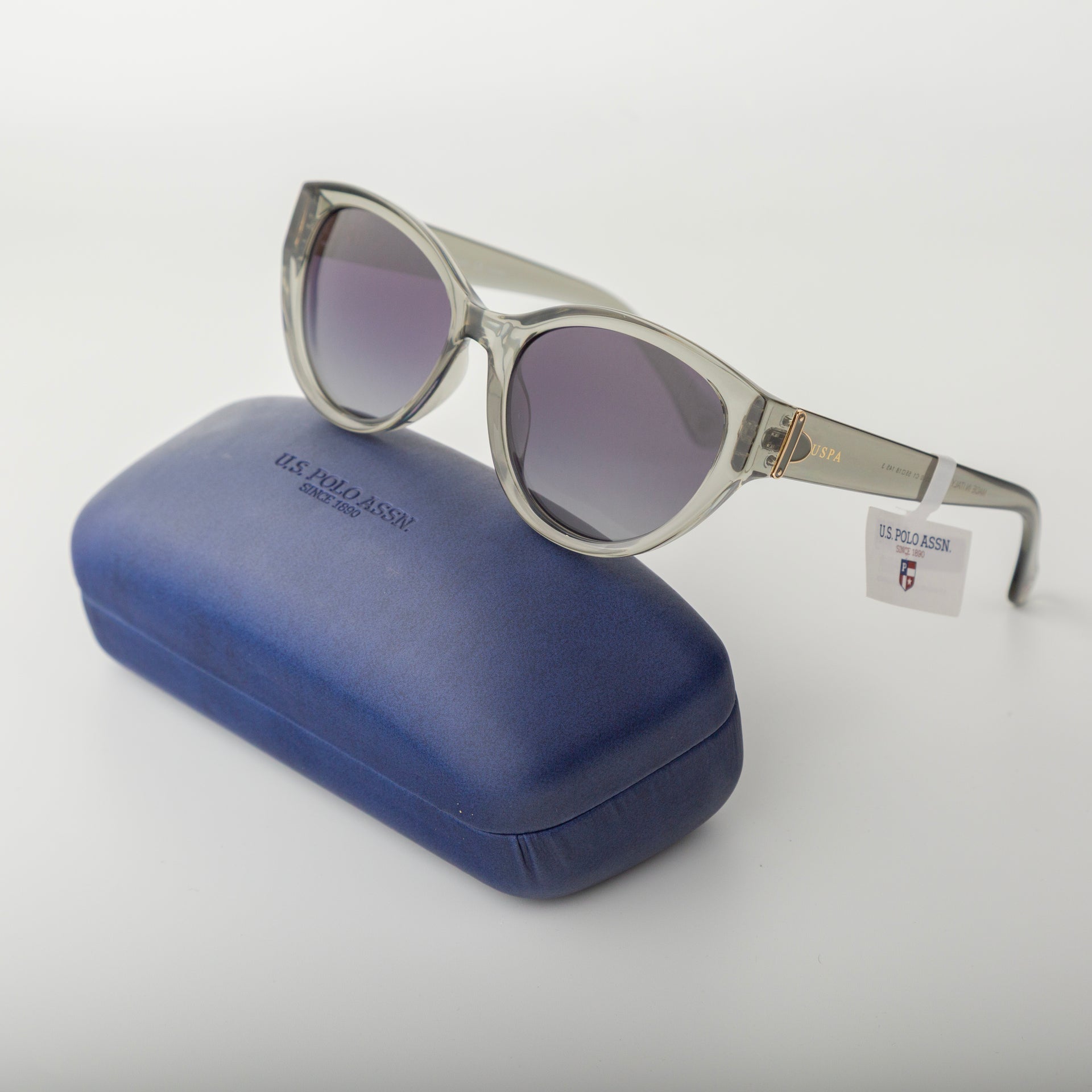 Sunglasses with a blue case on a white background