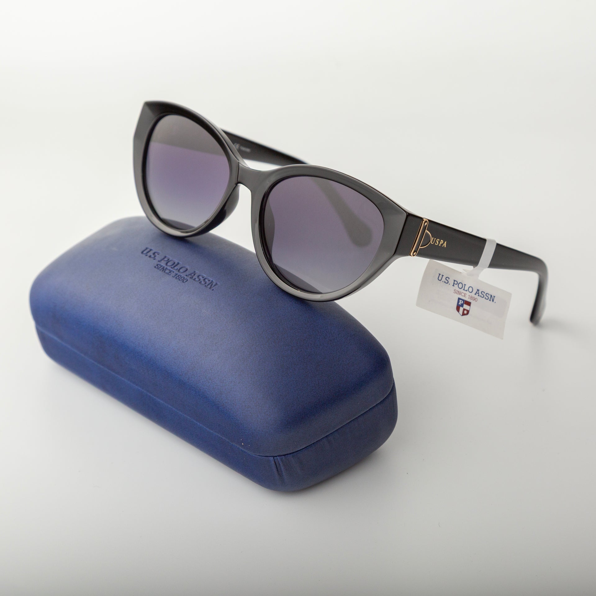 Sunglasses with a U.S. Polo Assn. case on a white background