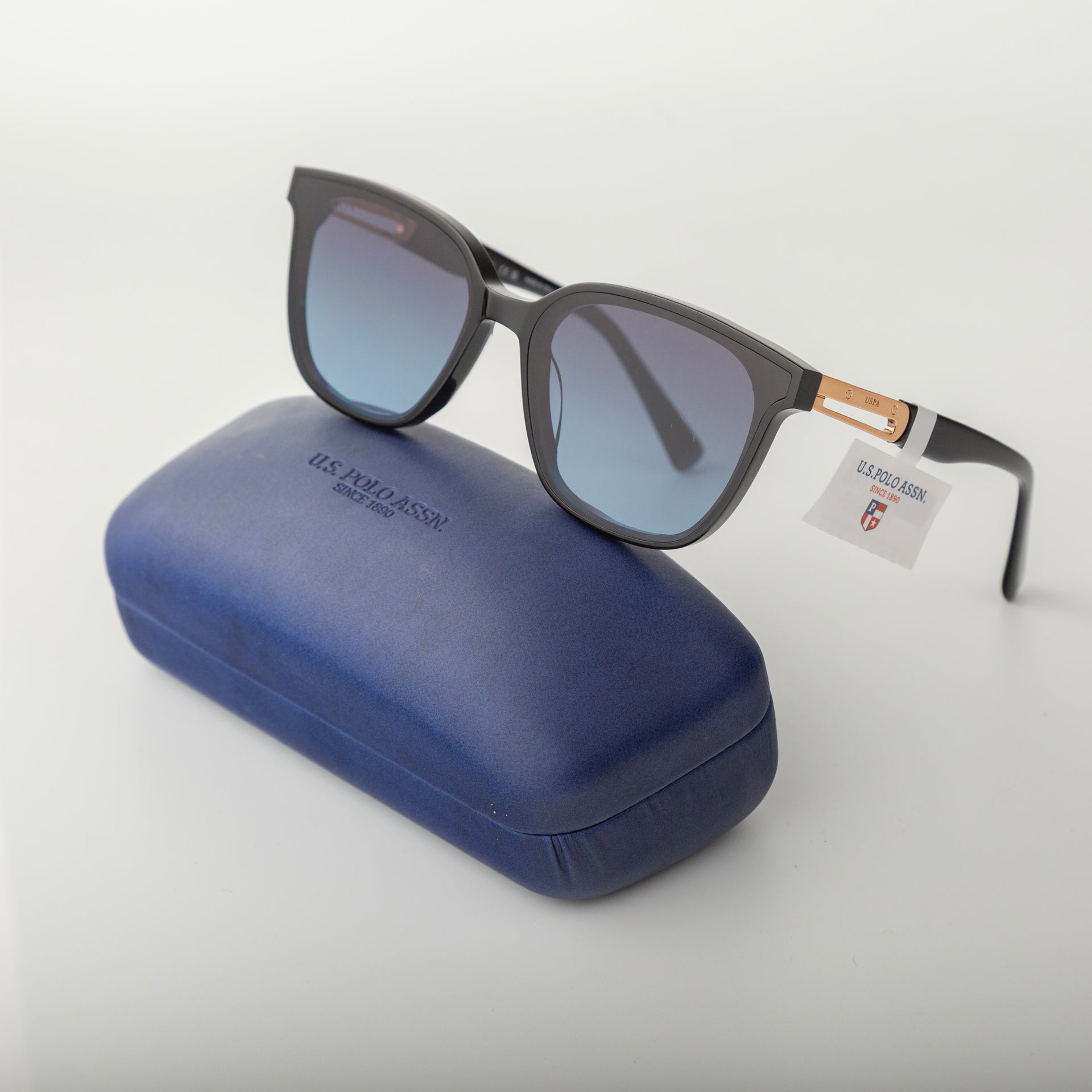 Sunglasses with a blue case on a white background