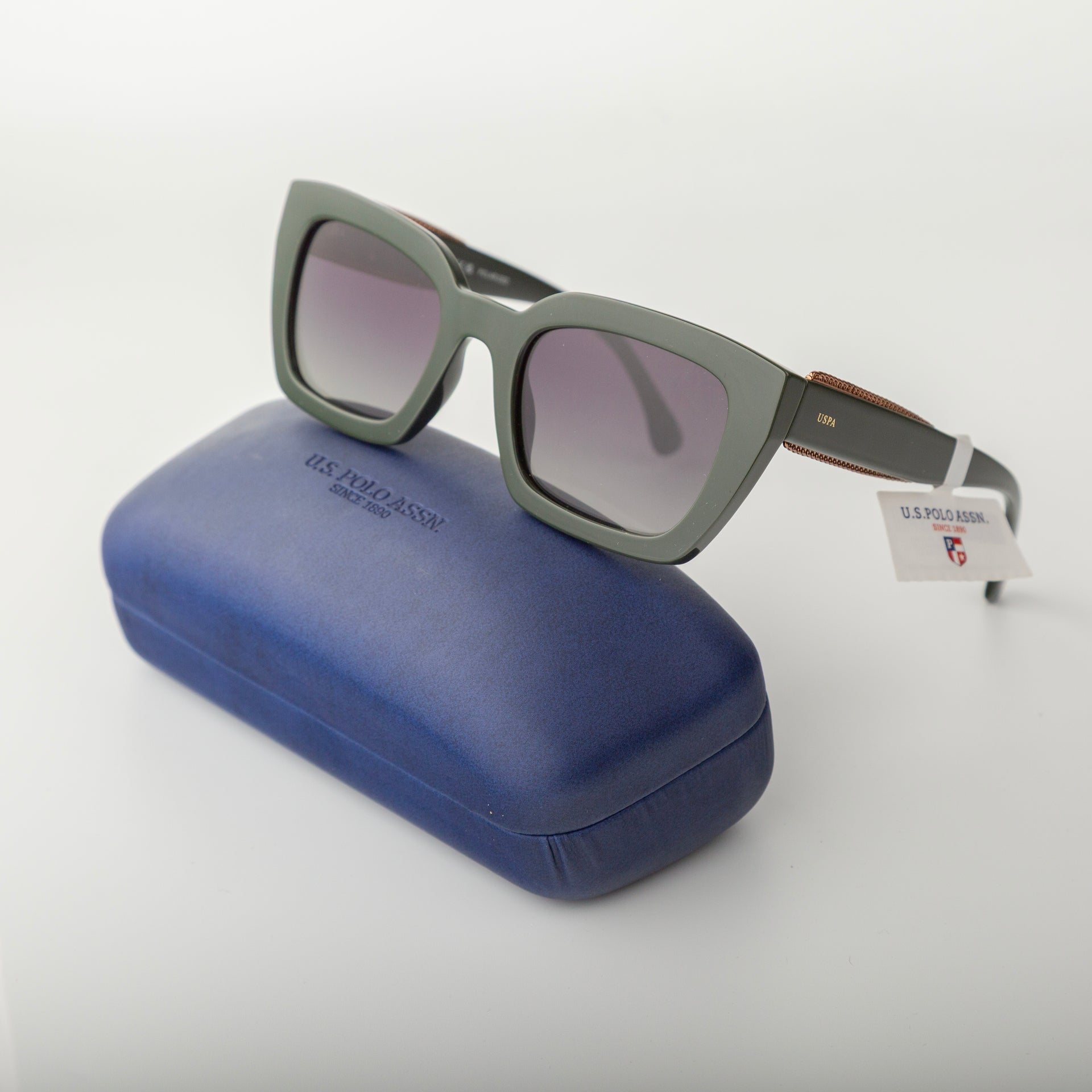 Sunglasses with a blue case on a white background