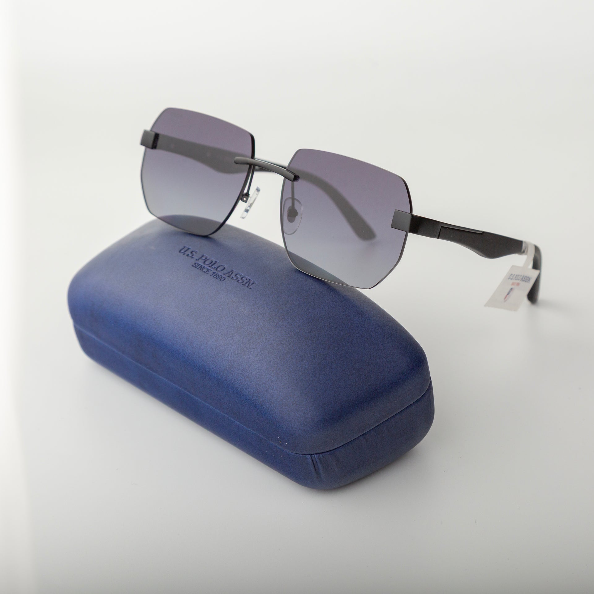 Sunglasses with a blue case on a white background