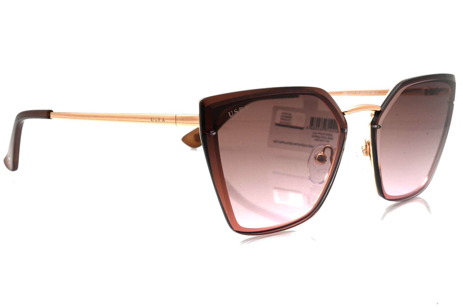 Cat-eye sunglasses with gold frame and gradient lenses on a white background