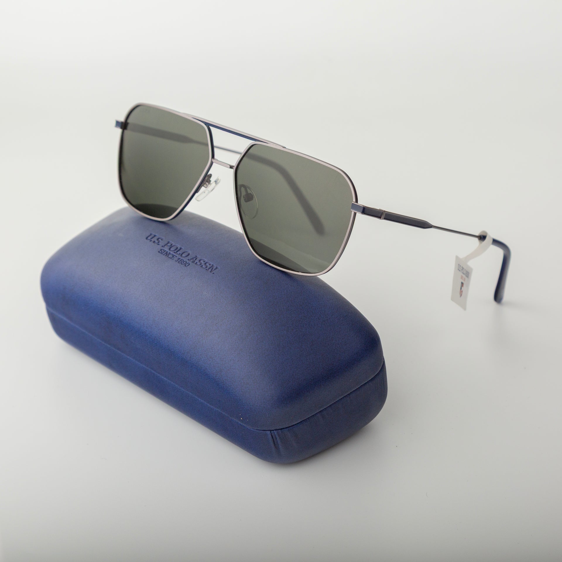 Sunglasses with a blue case on a white background