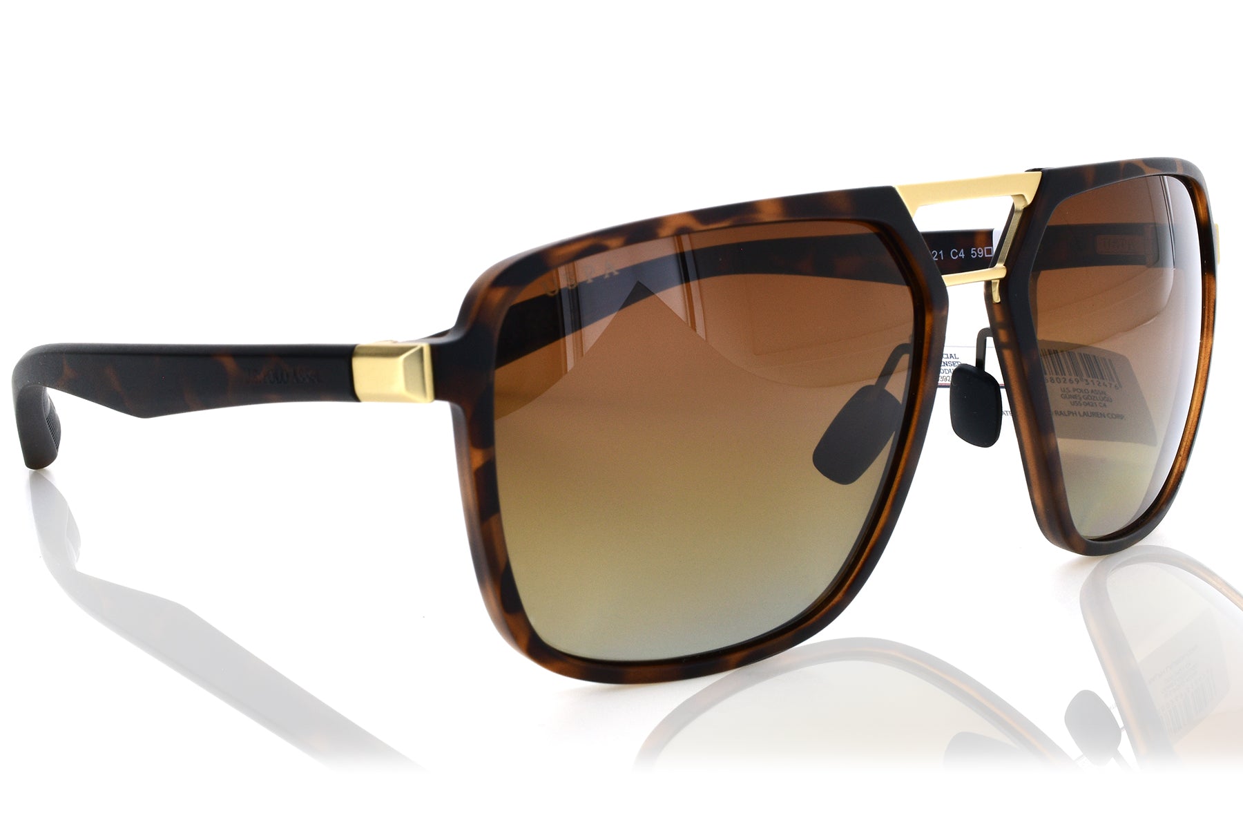 Sunglasses with tortoiseshell frame and brown gradient lenses on a white background