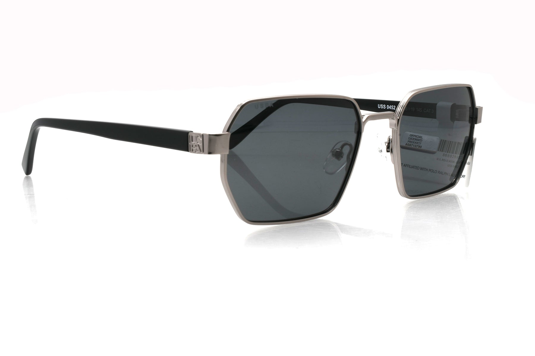 Sunglasses with black frames and dark lenses on a white background