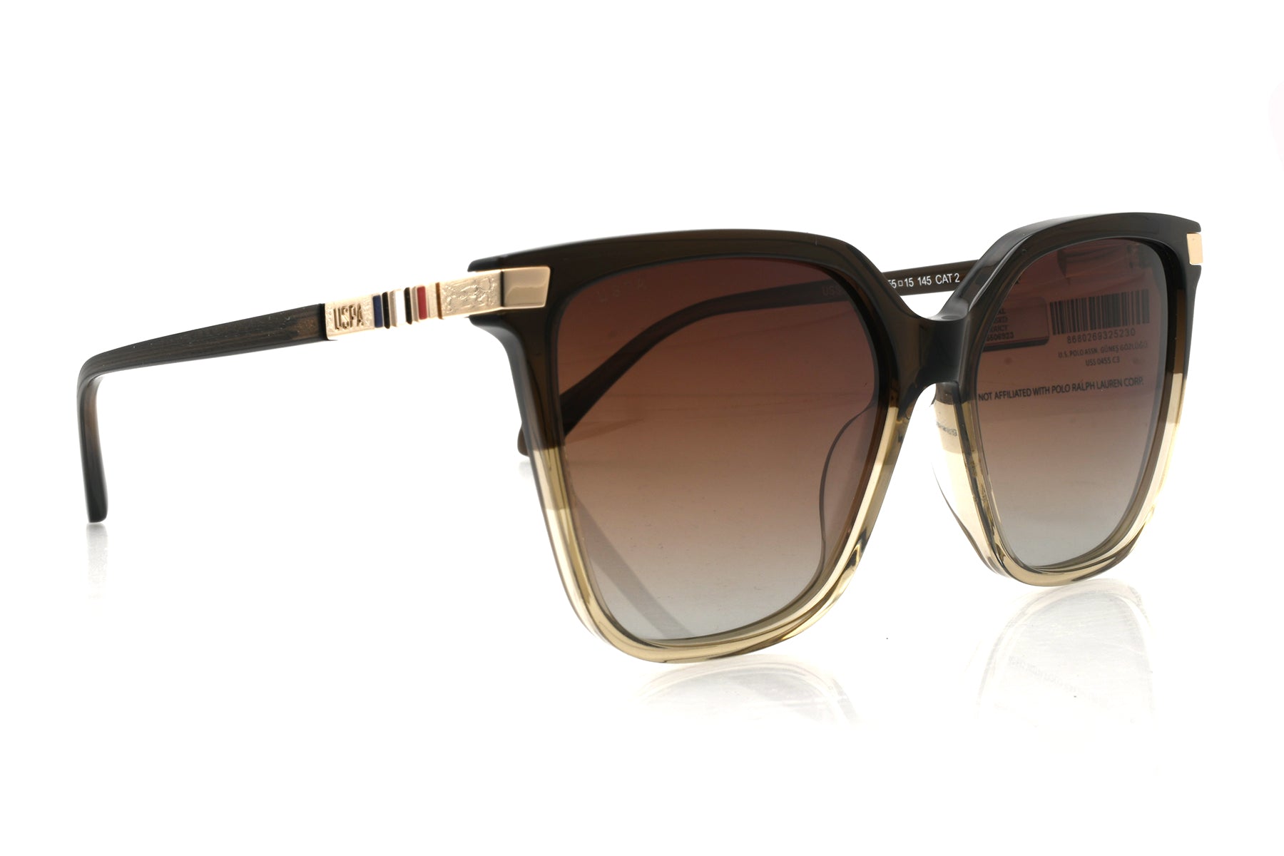 Sunglasses with gold and black frame on a white background