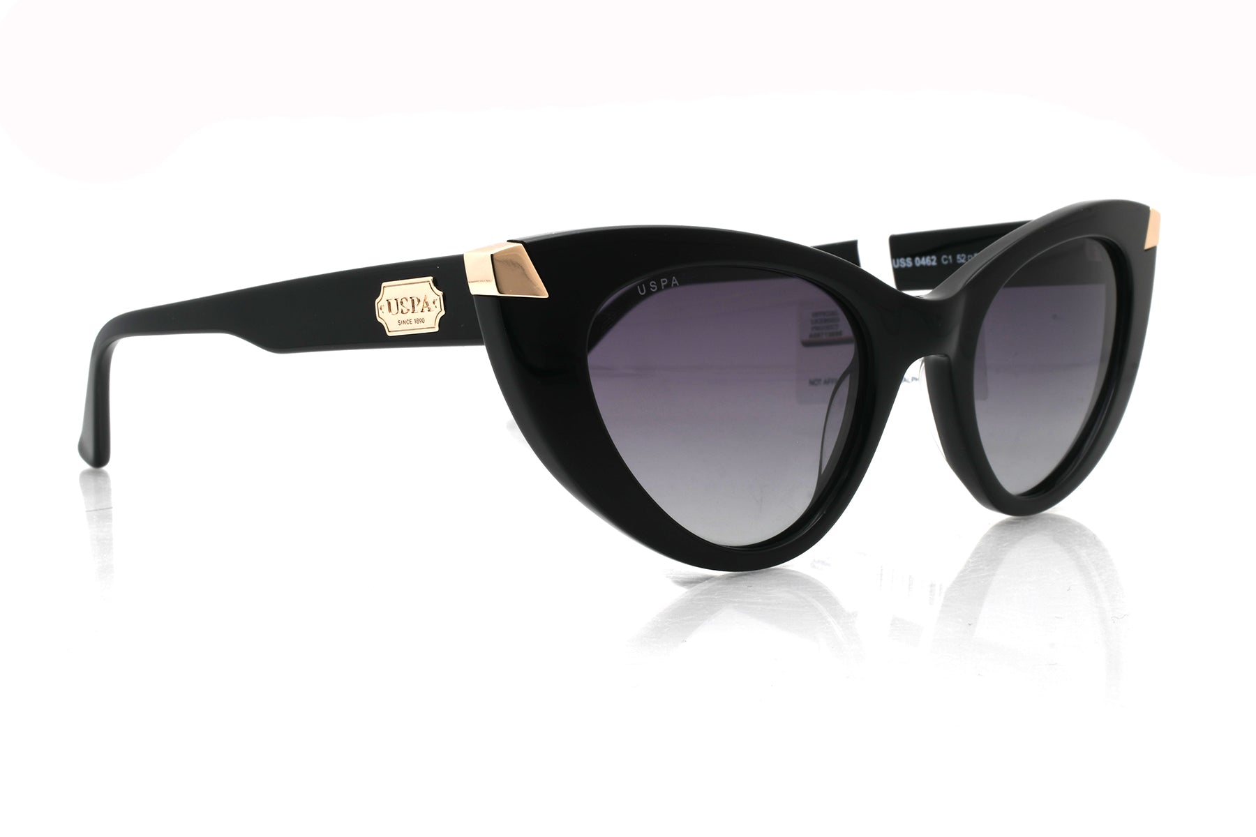 Black cat-eye sunglasses with gold accents on a white background