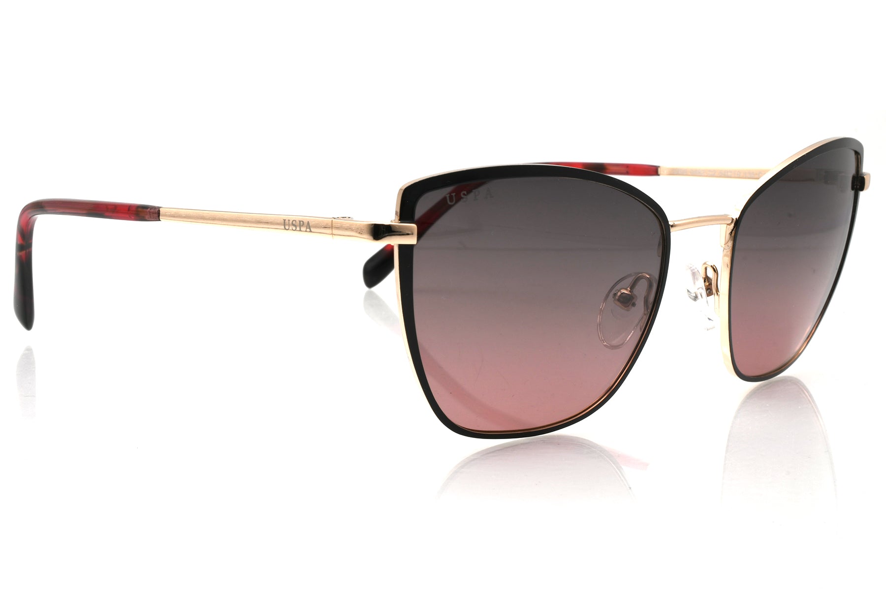 Sunglasses with gold frame and red accents on a white background