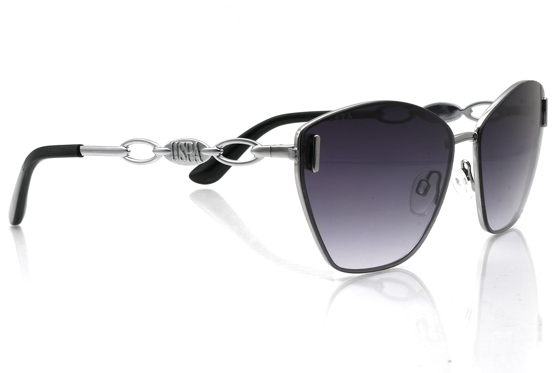 Sunglasses with black gradient lenses and silver frame on a white background